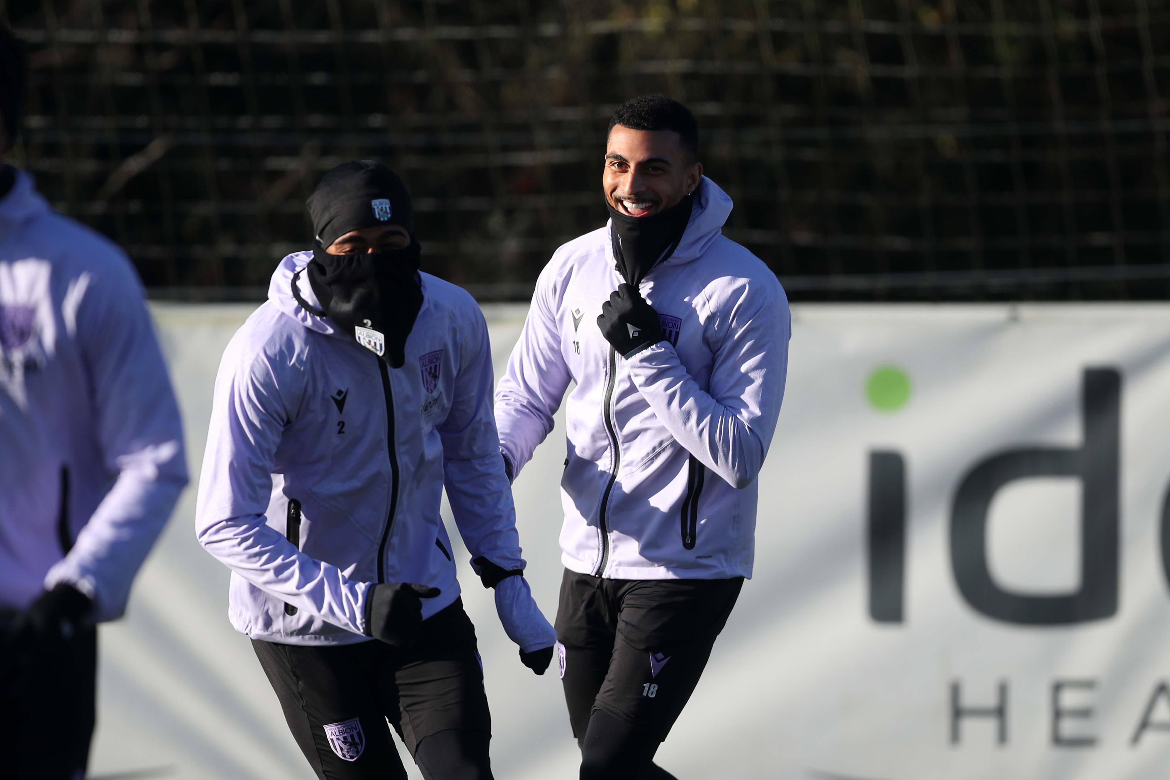 Karlan Grant and Darnell Furlong laughing during a training session 