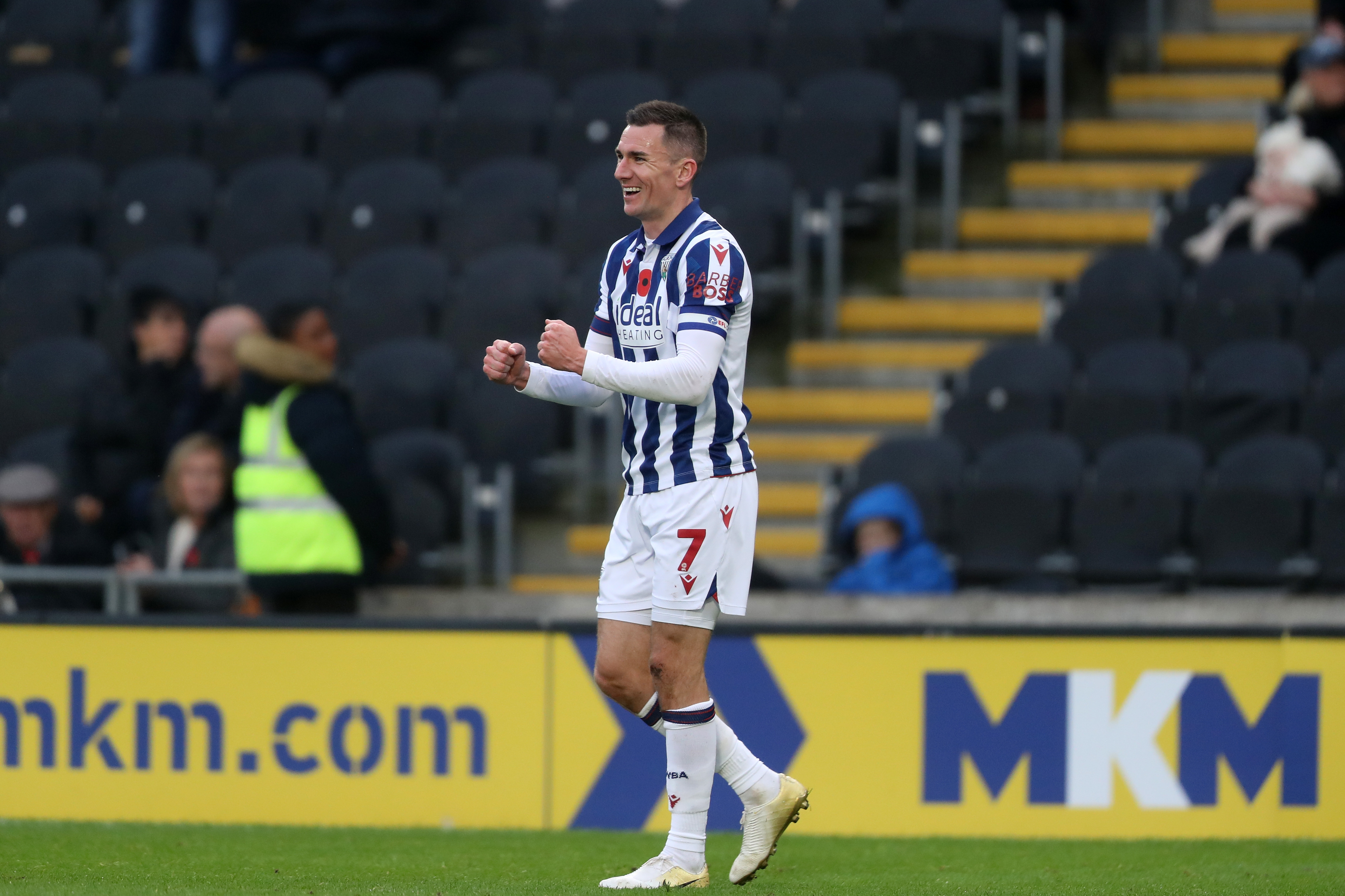 Jed Wallace celebrates a win after the full-time whistle