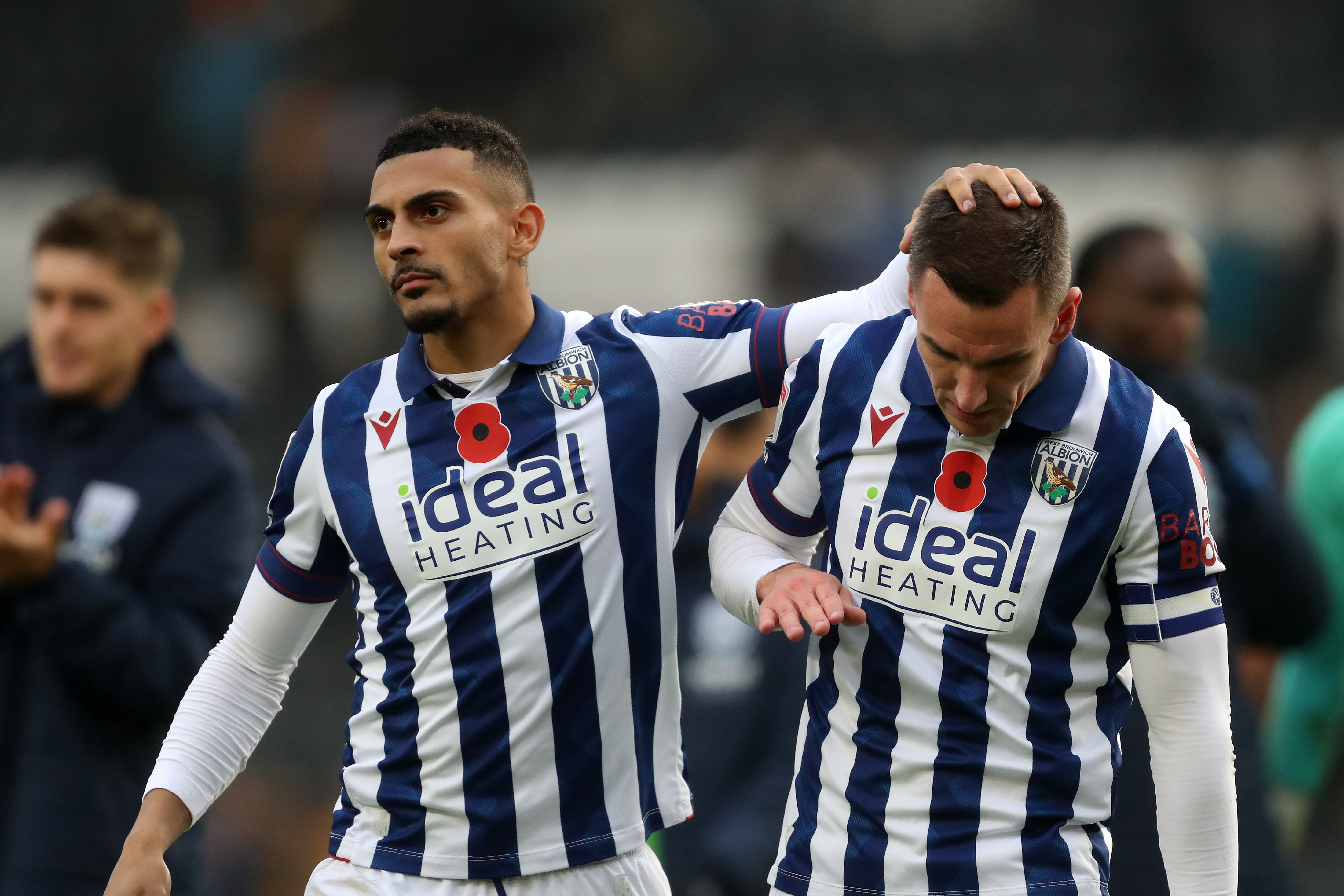 Karlan Grant and Jed Wallace embrace at full-time at Hull