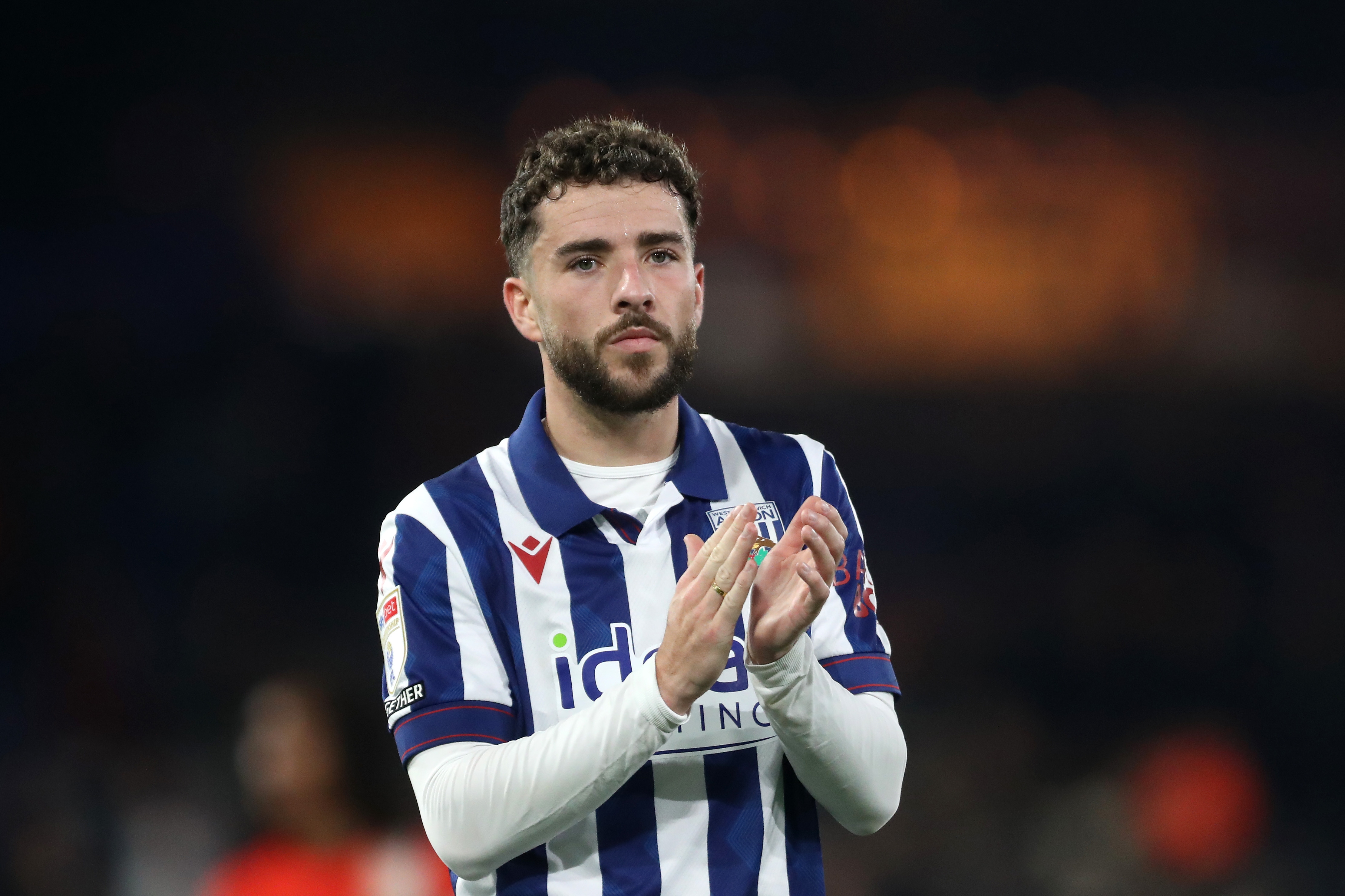 Mikey Johnston applauds Albion fans at full-time at Luton 