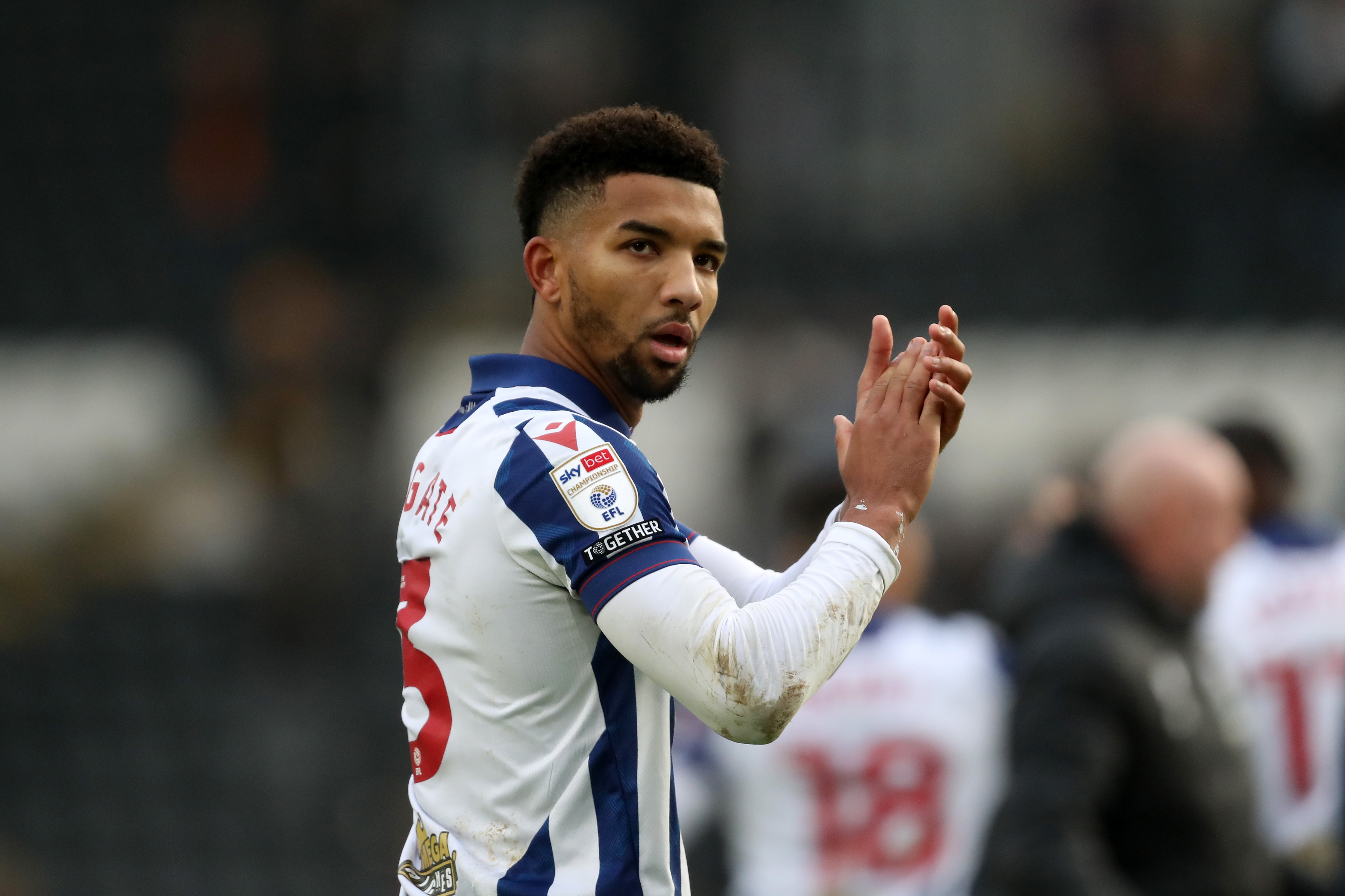 Mason Holgate applauds Albion fans at full-time at Hull