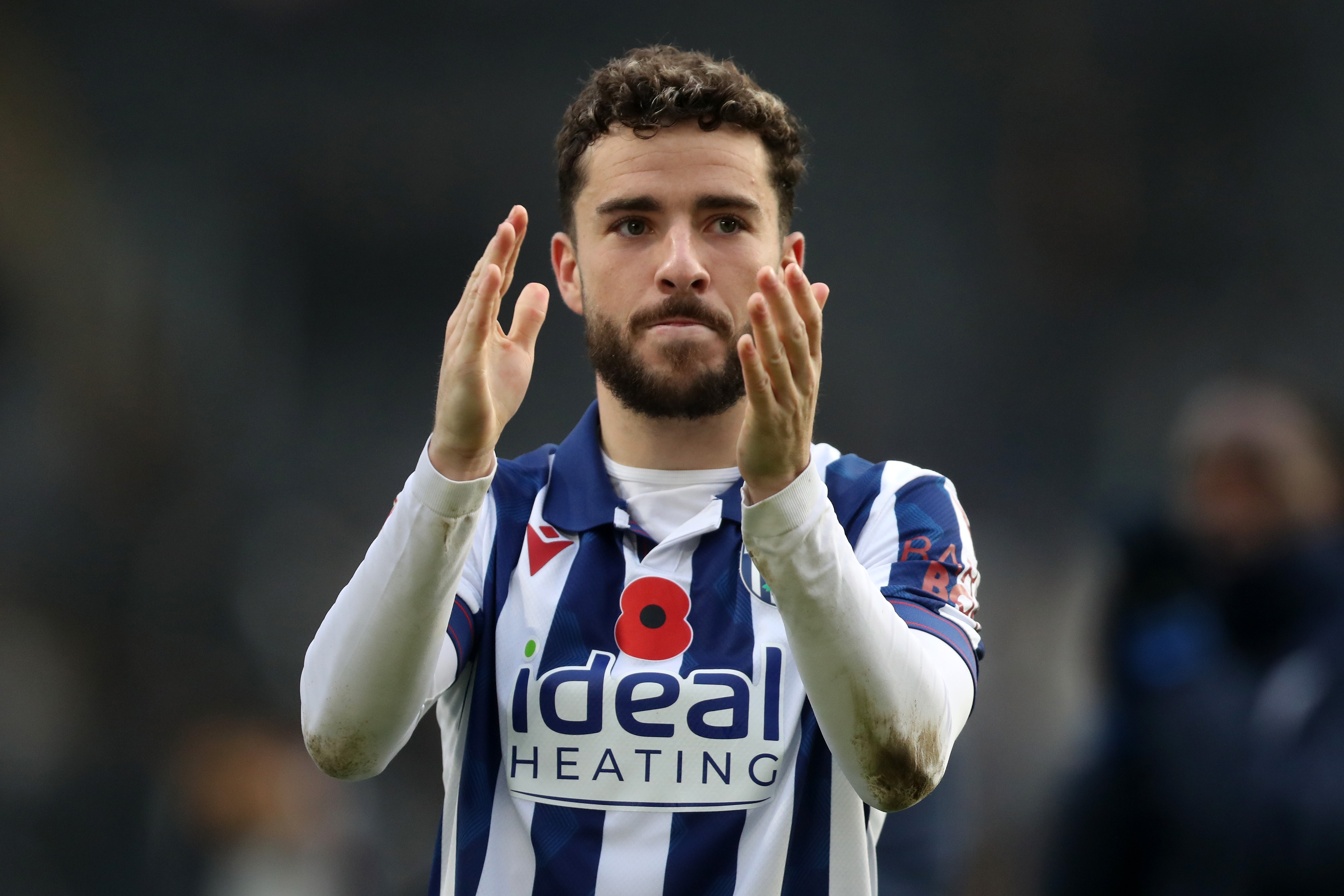 Mikey Johnston applauds Albion fans at full-time at Hull