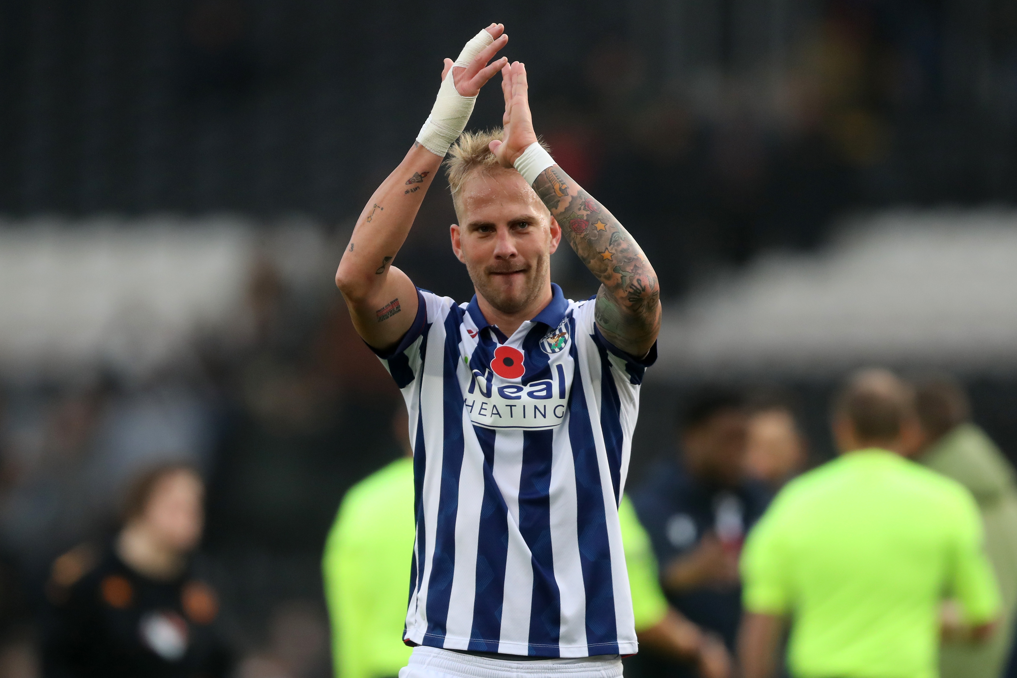 Uroš Račić applauds Albion fans at full-time at Hull