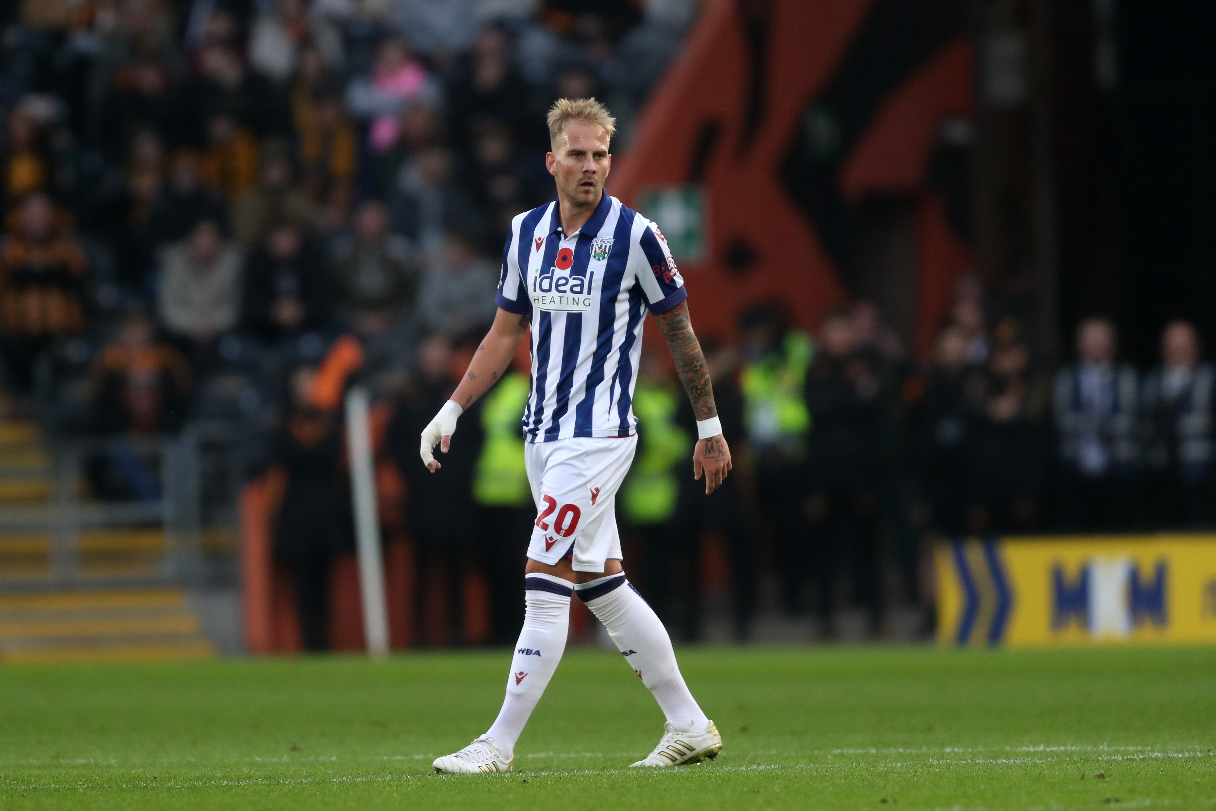 Uroš Račić watching play during the game against Hull