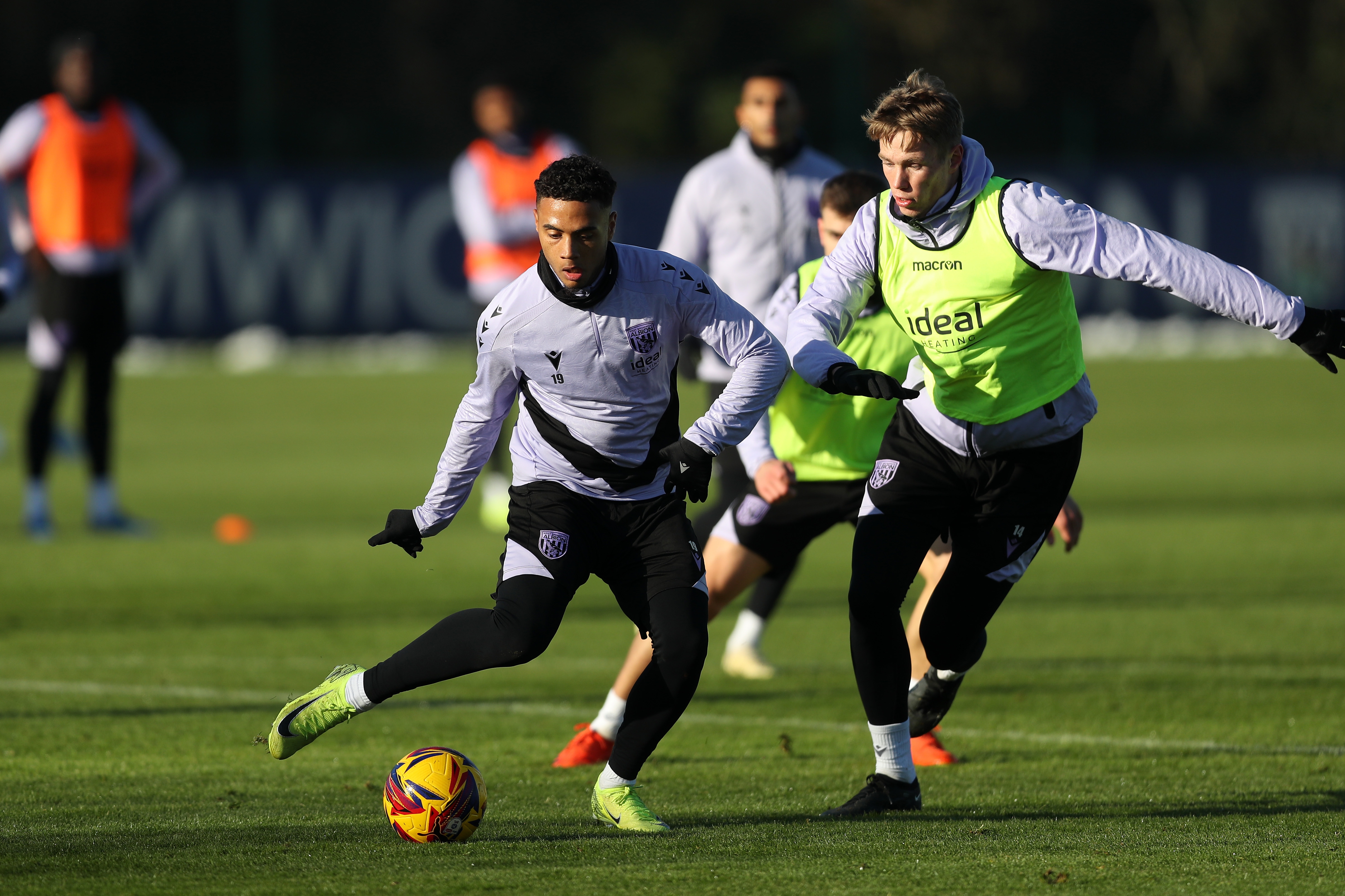 Lewis Dobbin on the ball during training with Torbjørn Heggem close by 