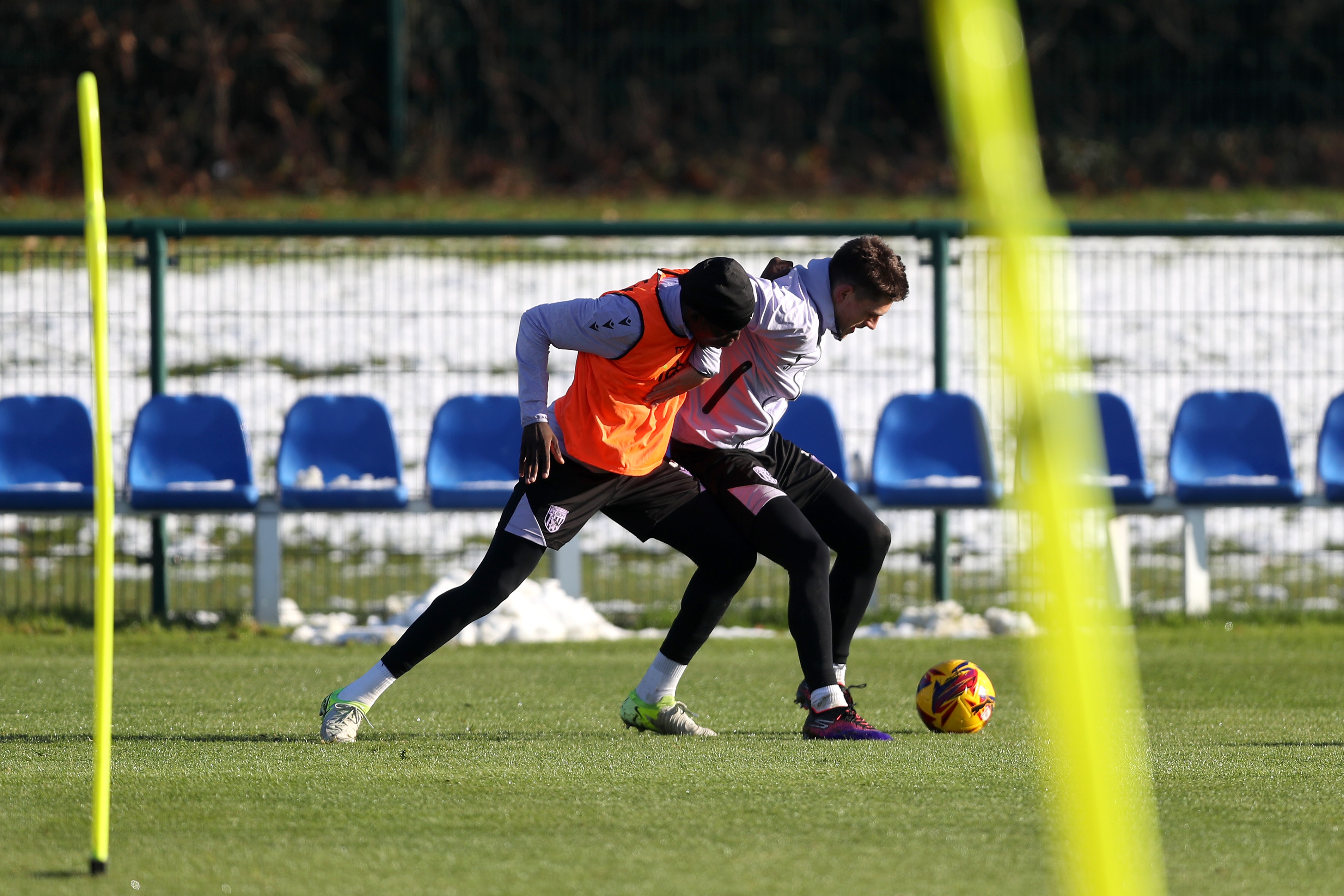 Tom Fellows shielding the ball from a defender during training 