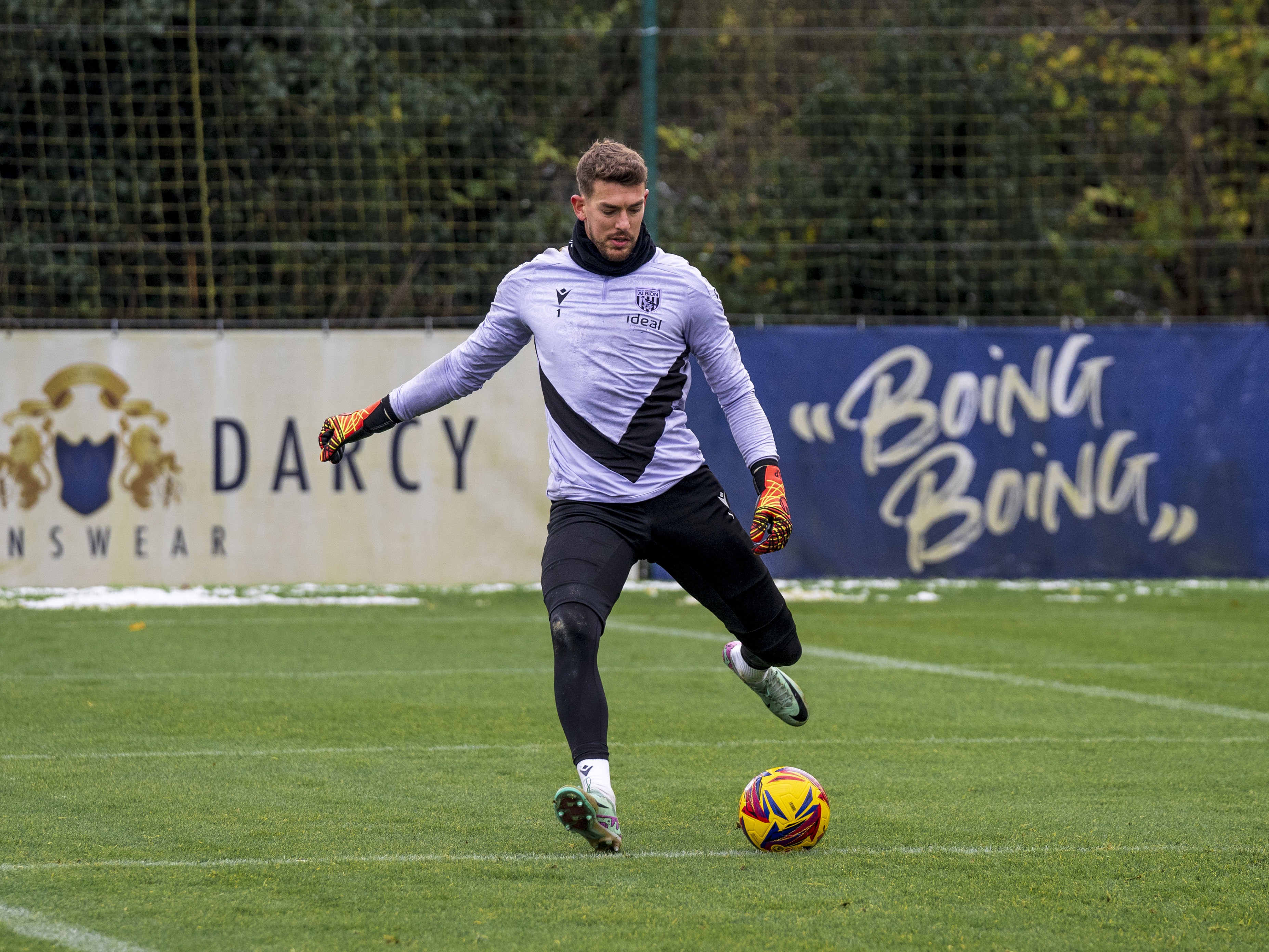 Alex Palmer passing the ball during training 