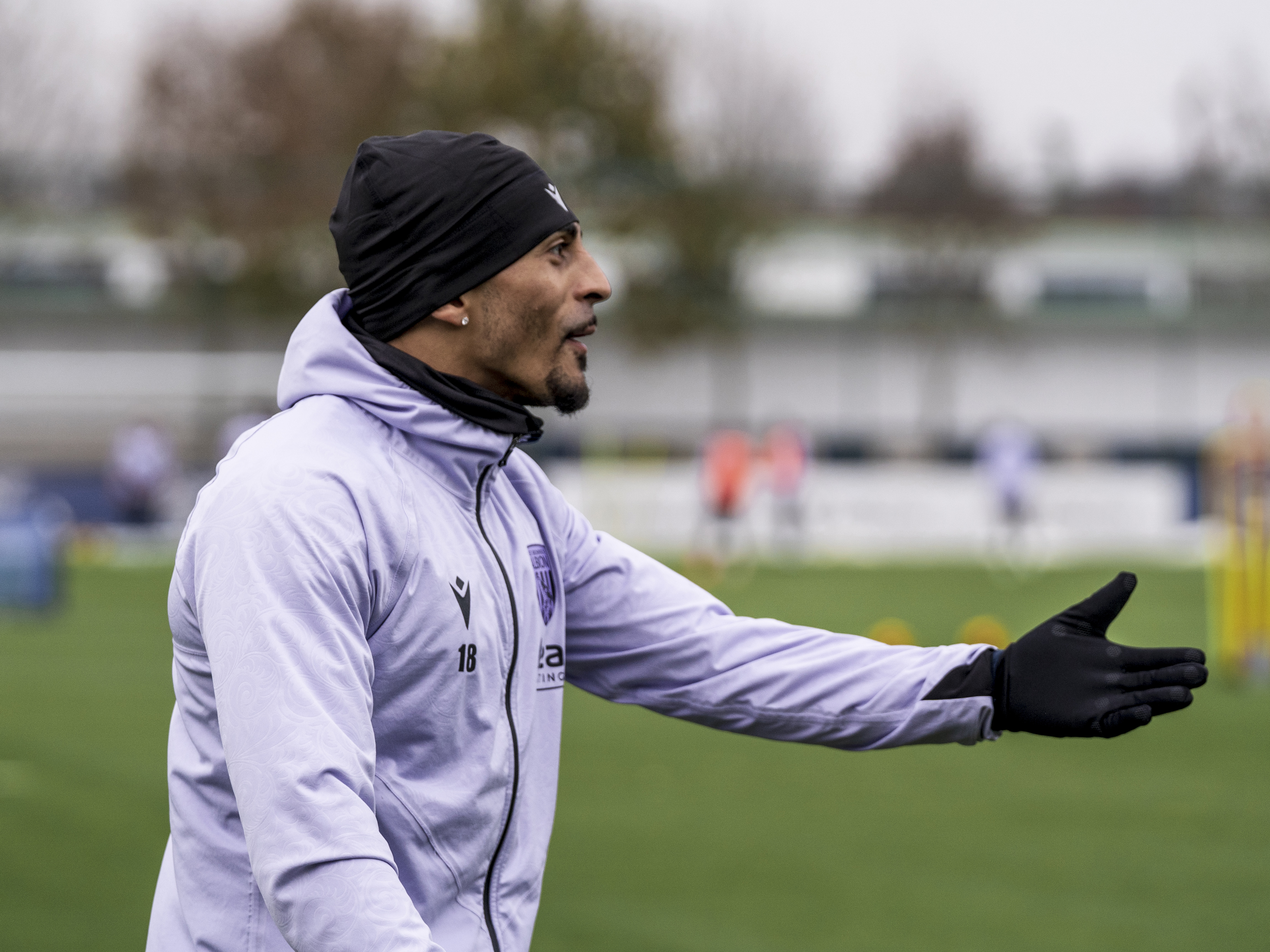 Karlan Grant with his arm out during a training session 