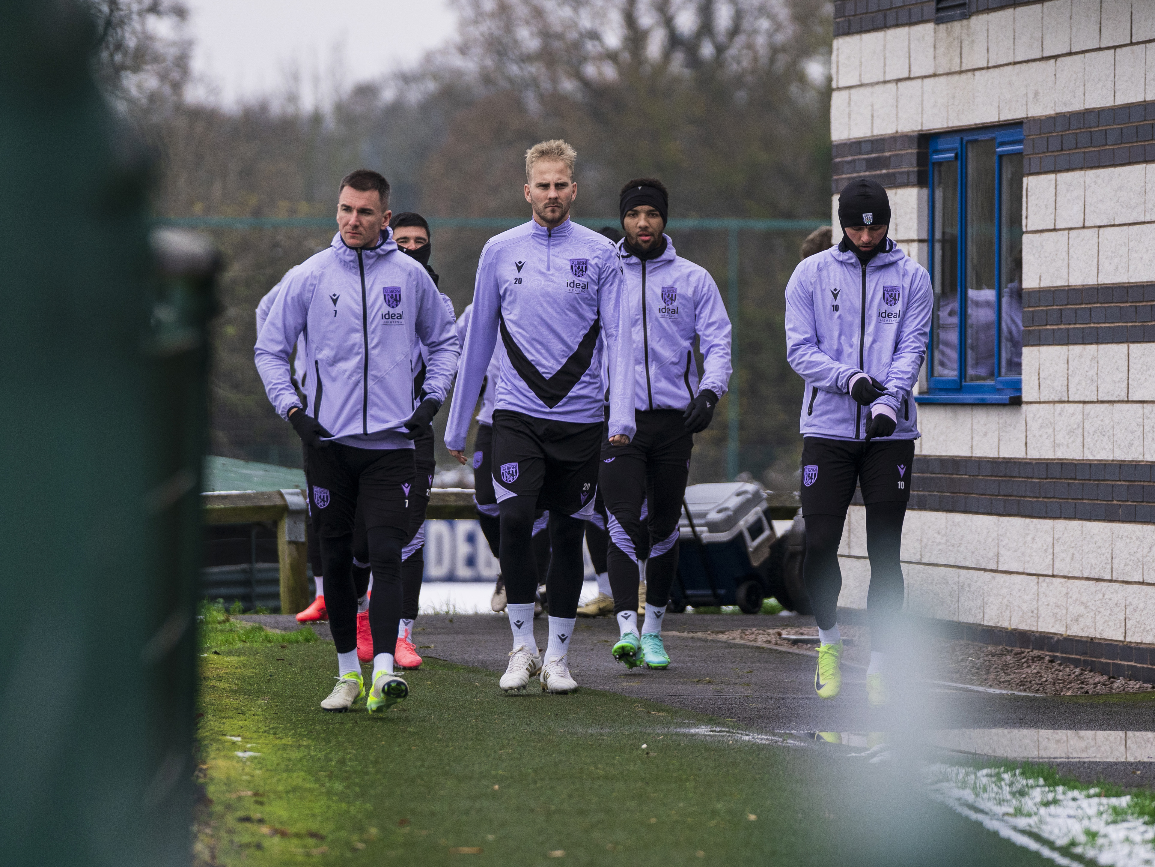 Several Albion players head out to training in the snow