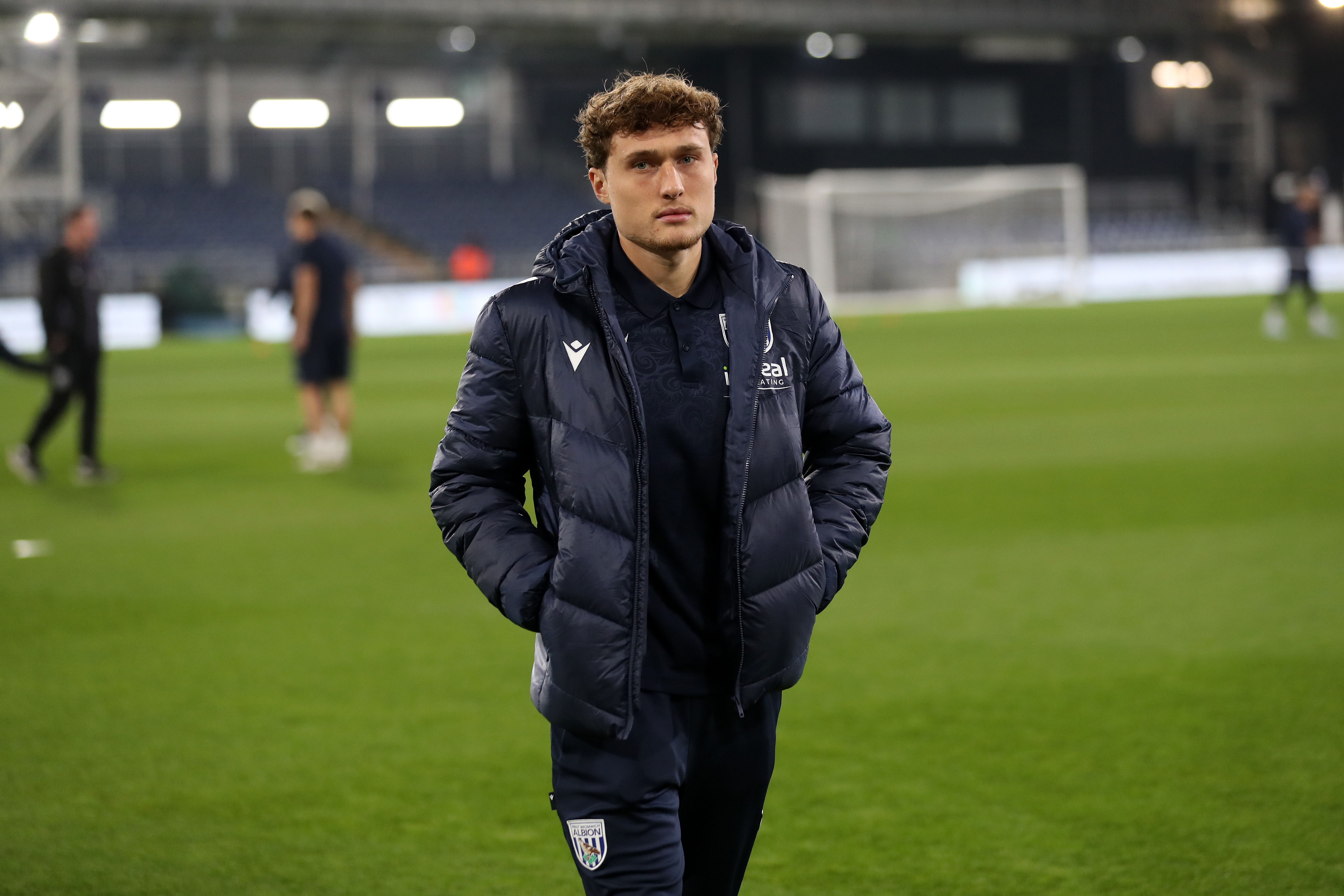 Callum Styles in his tracksuit on the pitch at Luton before the game 