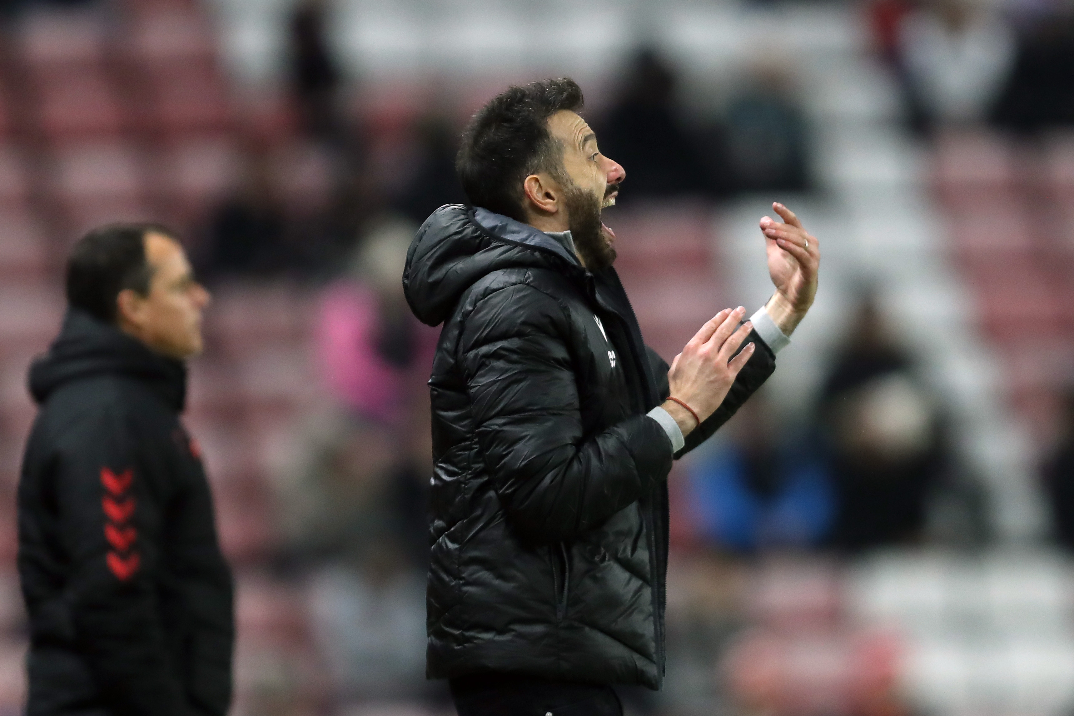 Carlos Corberán directing his players on the side of the pitch at the Stadium of Light 