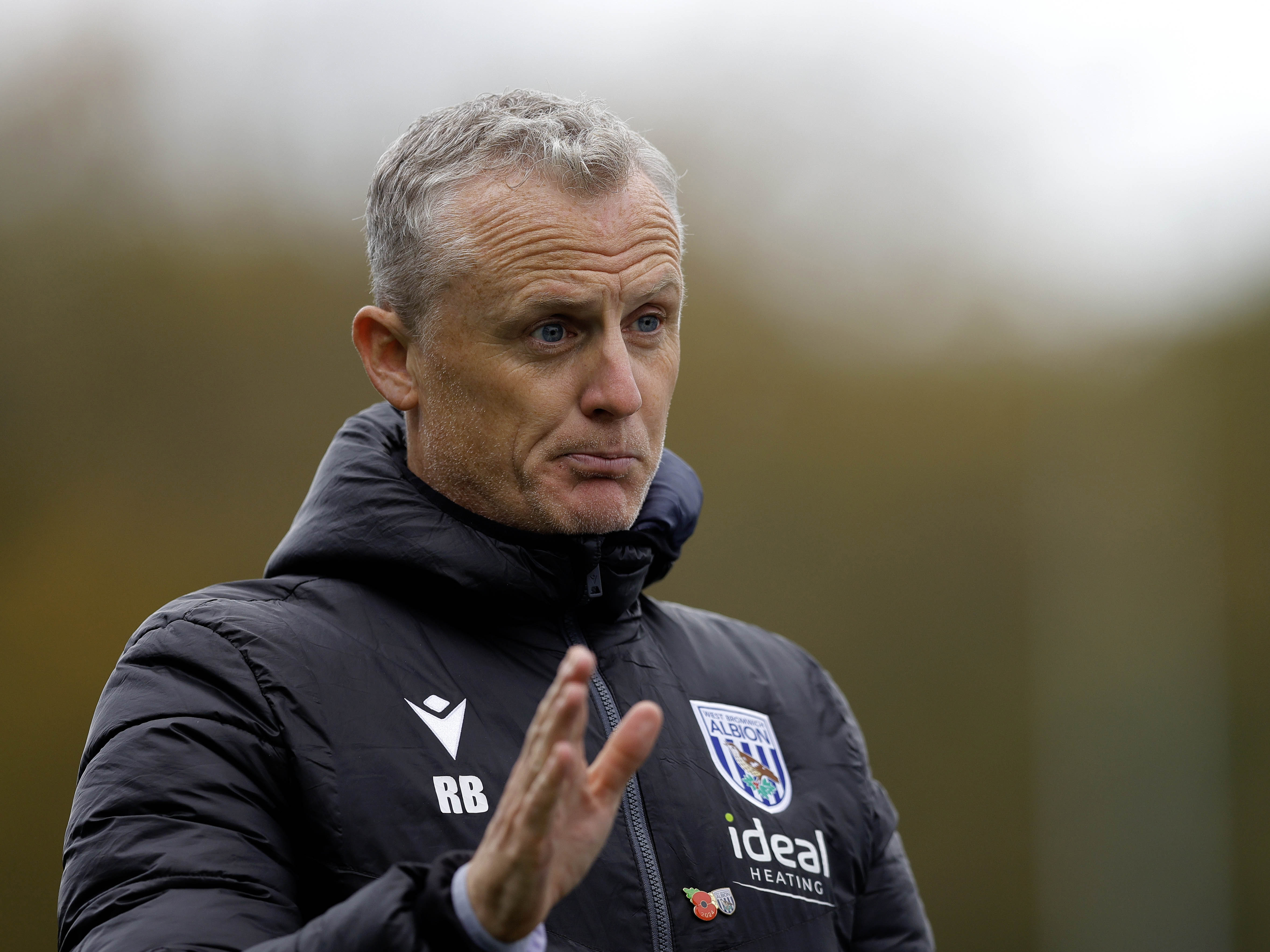 A photo of Albion U21s boss Richard Beale in a black Baggies training coat