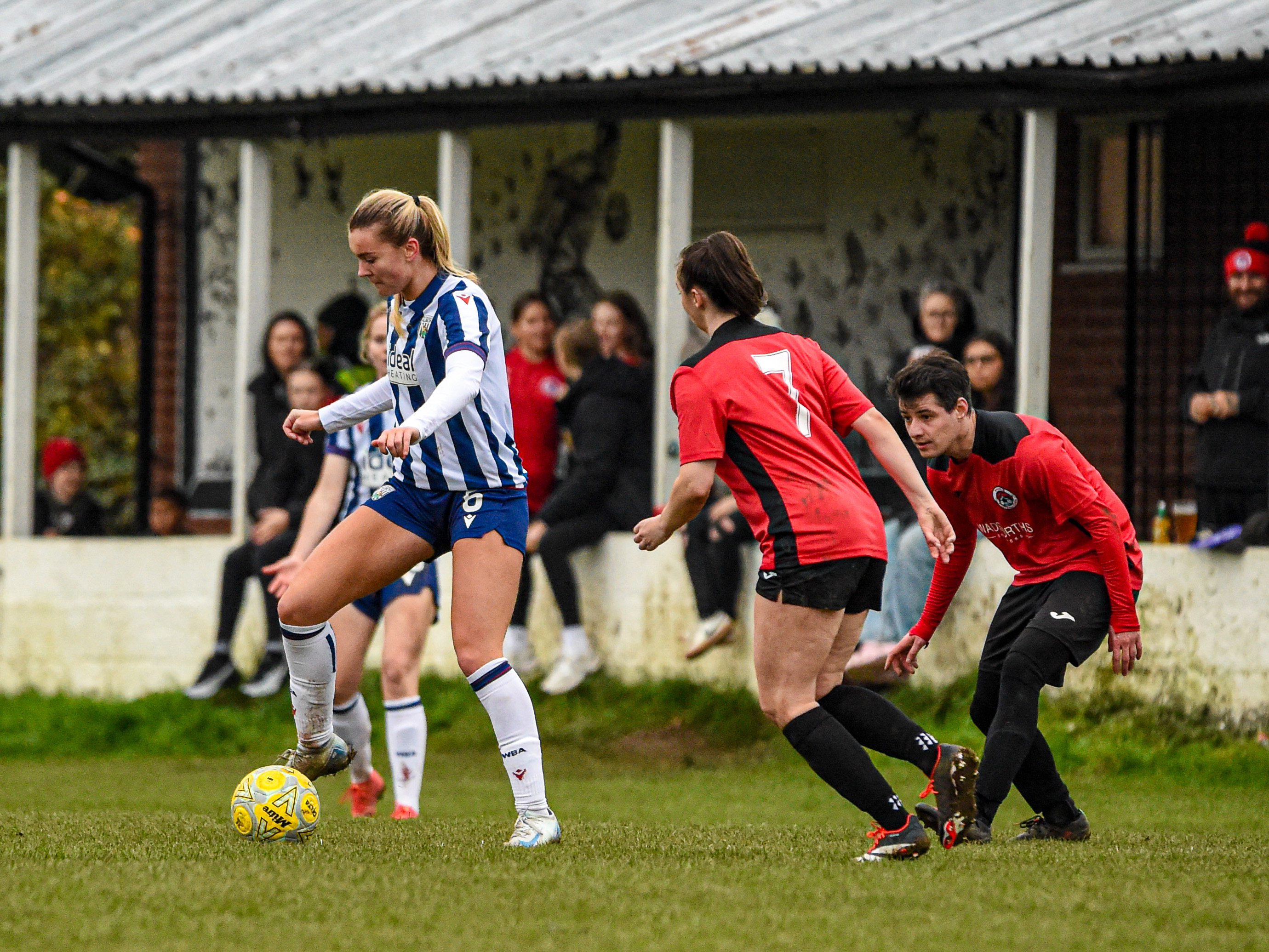 Taylor Reynolds in action in the home kit in an FA Cup game at Knowle Ladies 