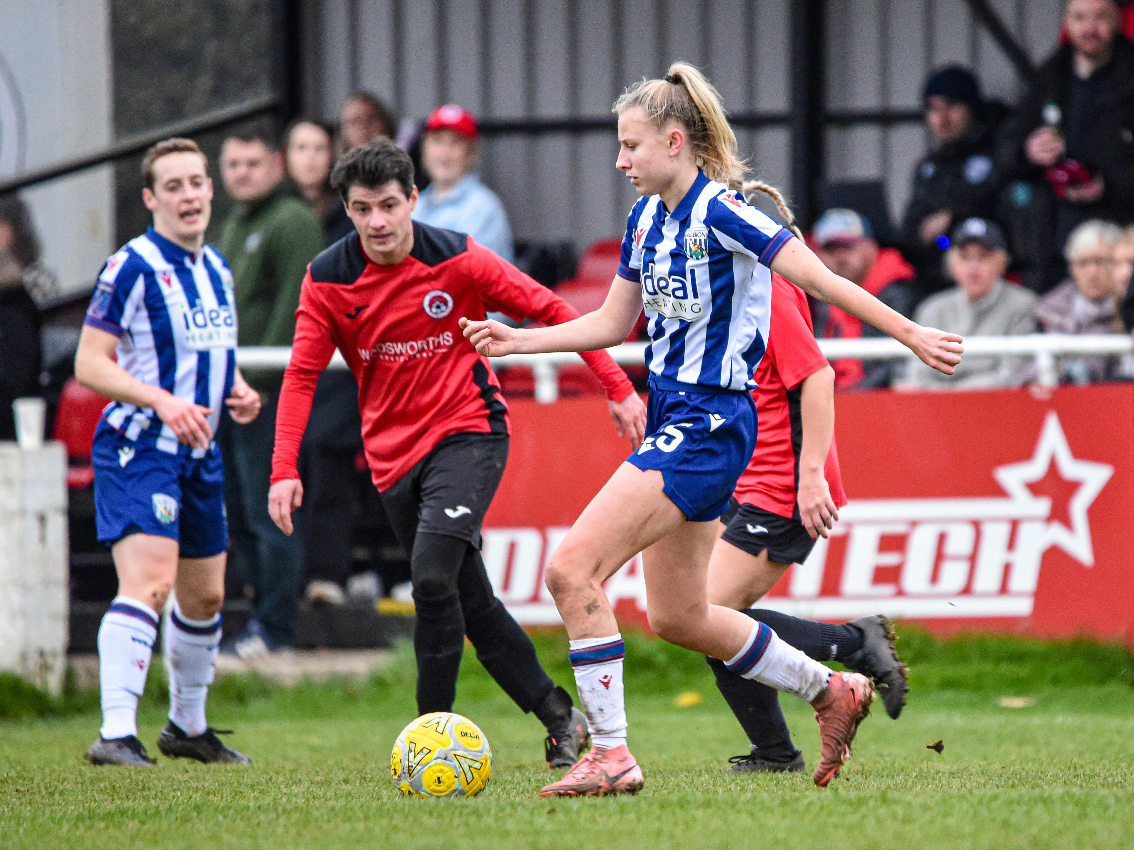 Izzie Whittick in action in the home shirt in an FA Cup game against Knowle