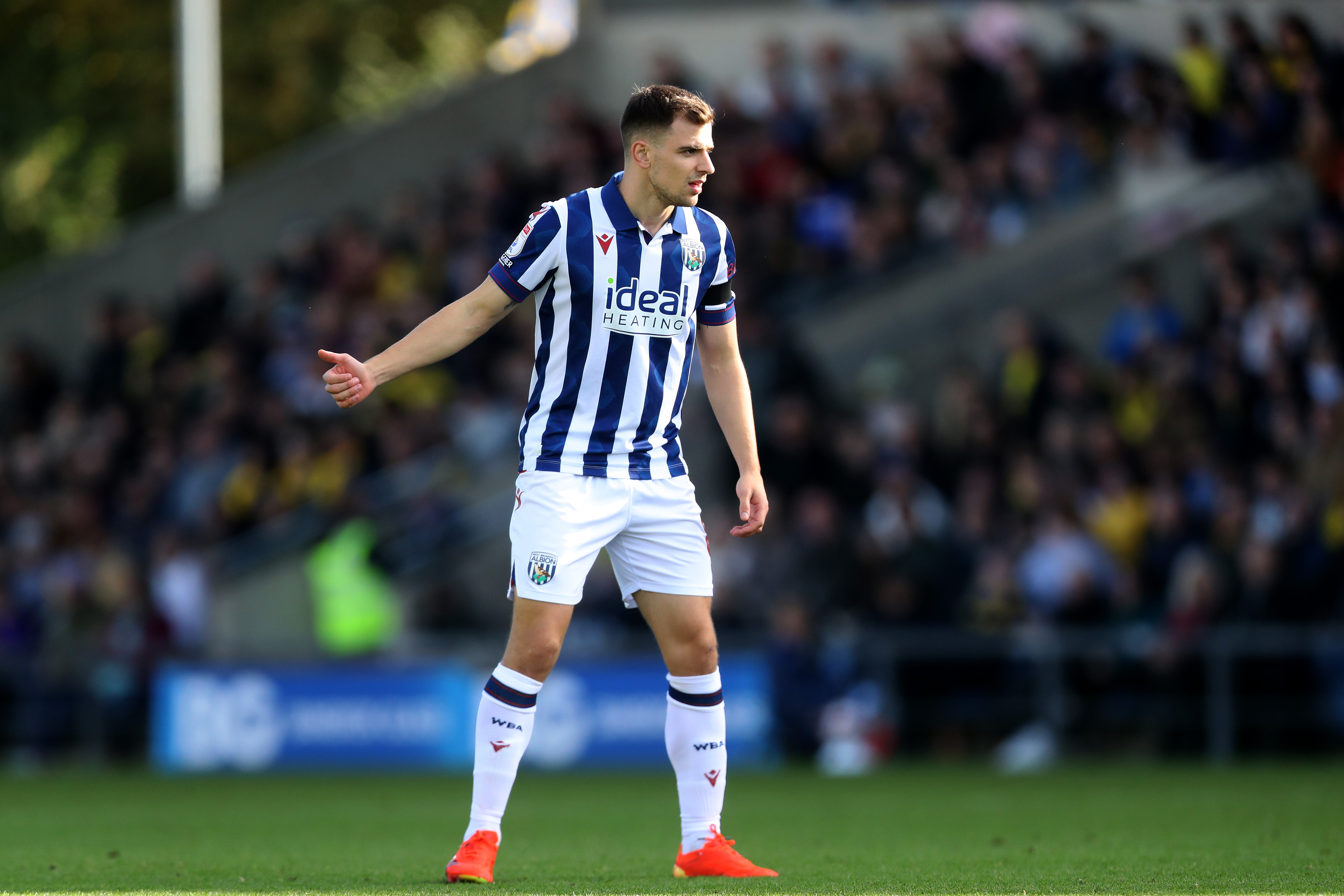 Jayson Molumby in action for Albion in the home kit 