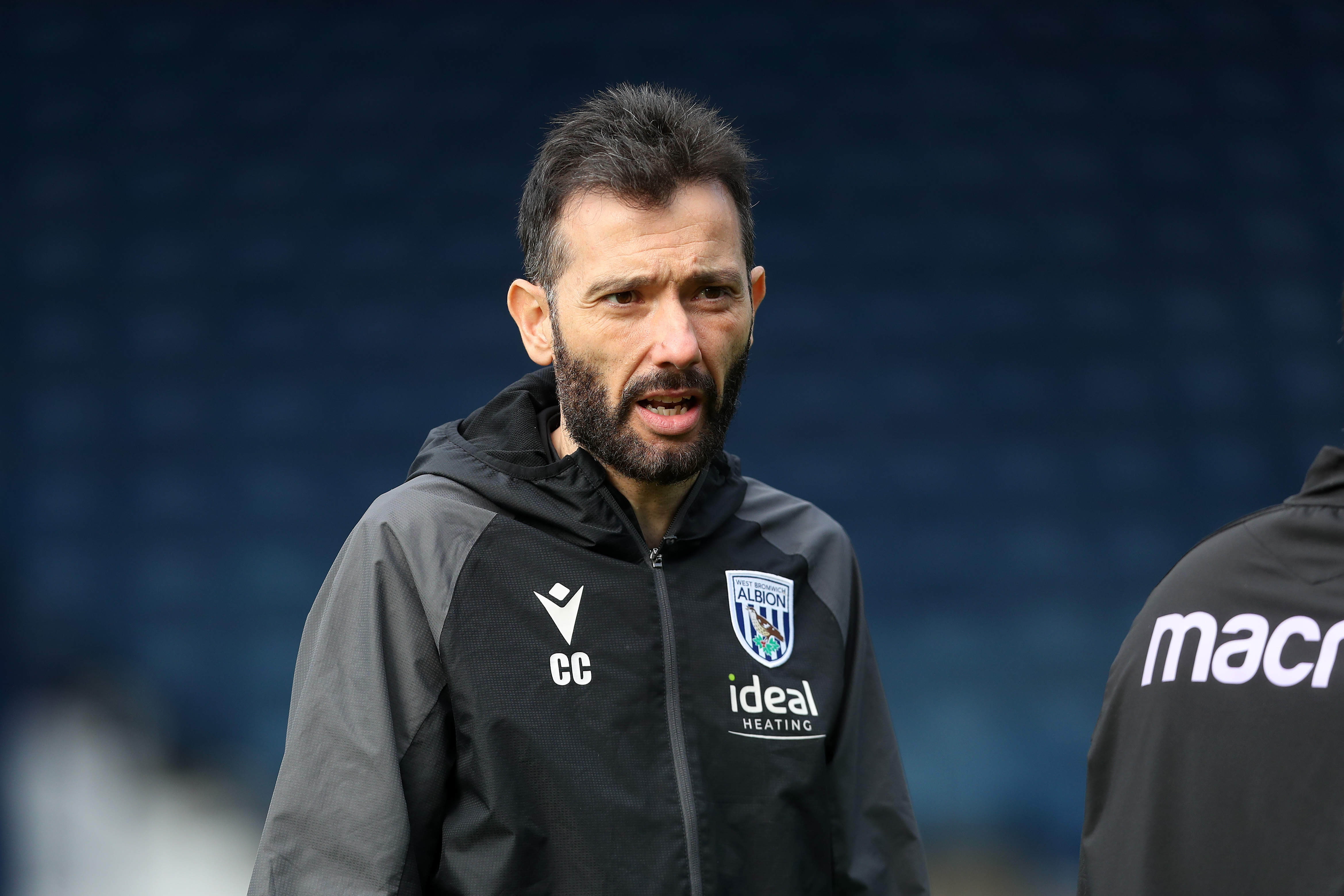 Carlos Corberán watching training at The Hawthorns 