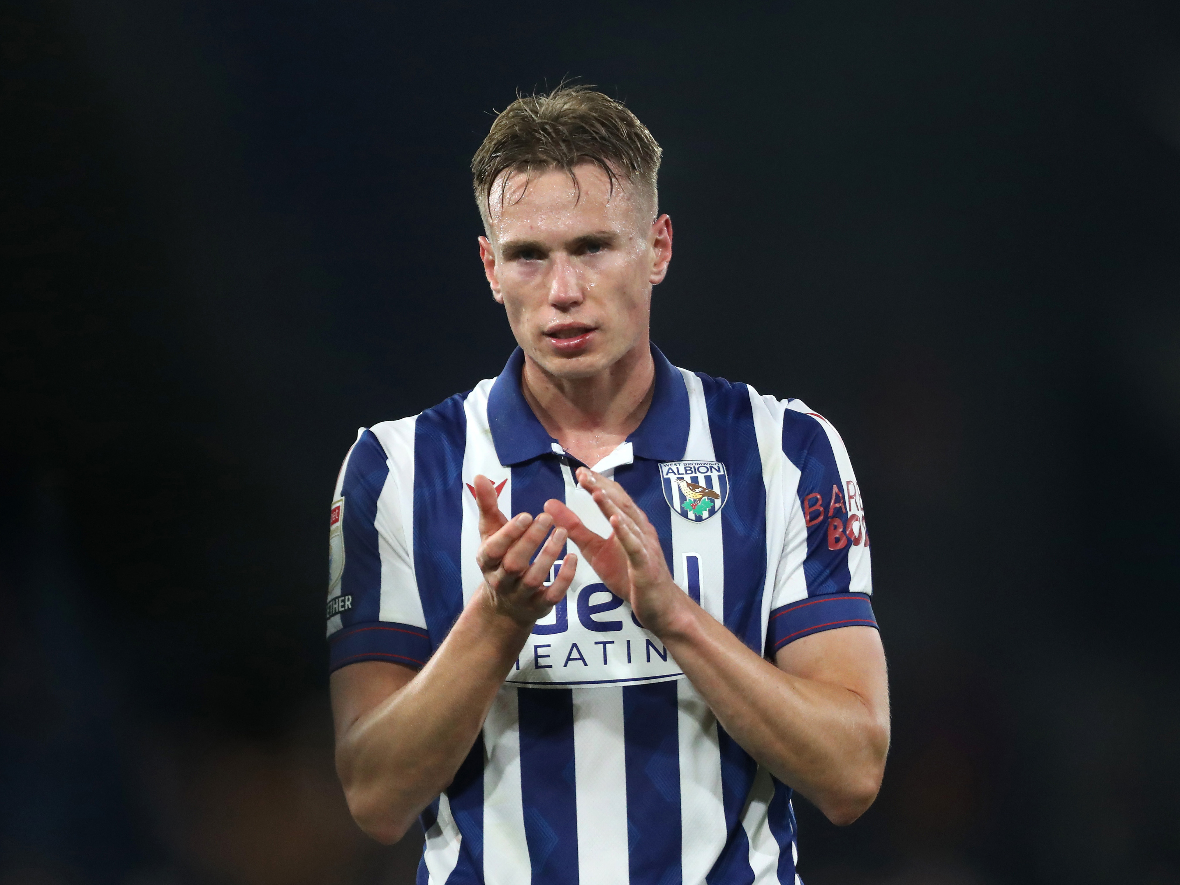 Torbjørn Heggem applauding Albion fans after a game while wearing the home kit 