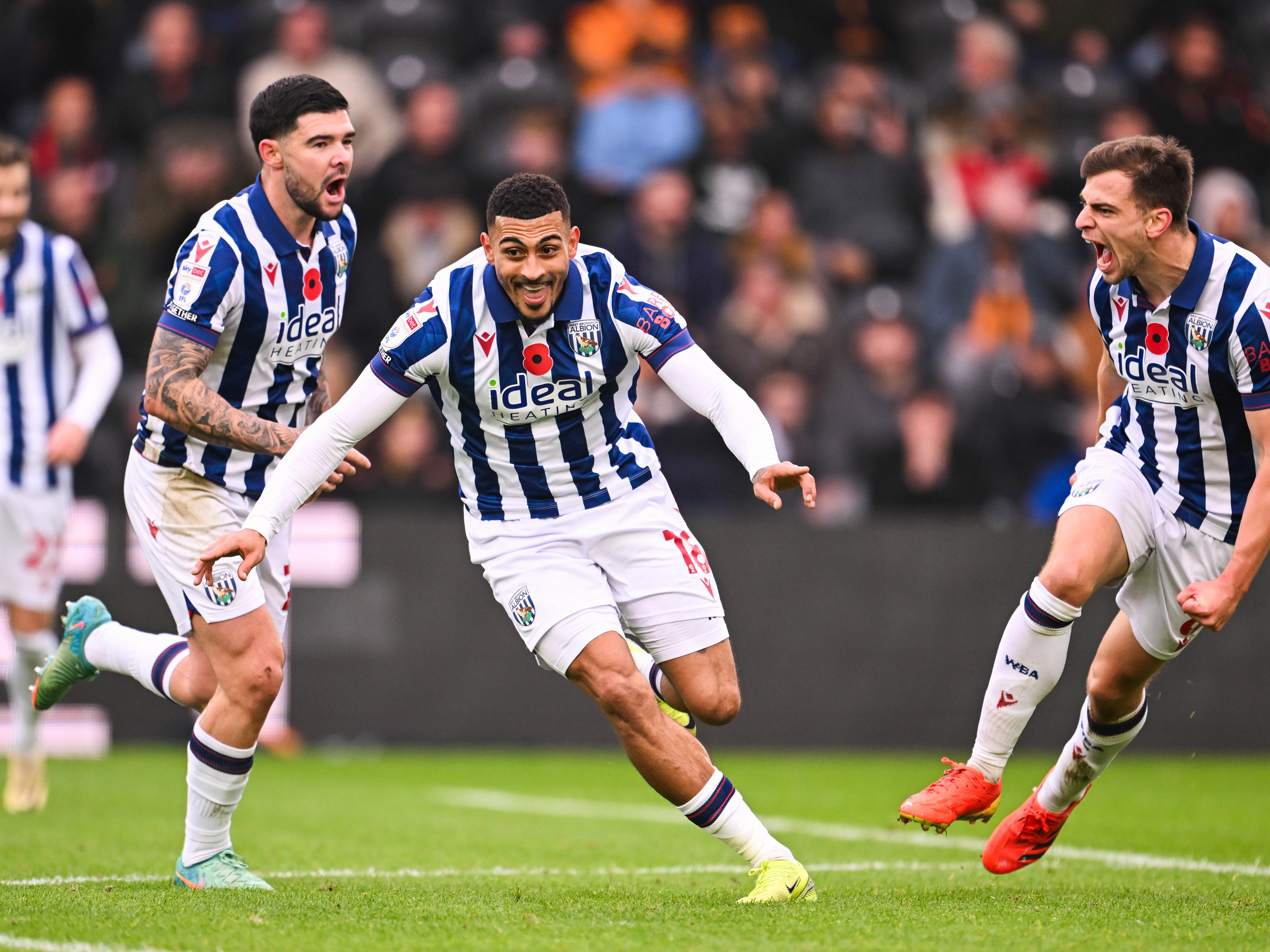 An image of Karlan Grant celebrating after scoring at Hull