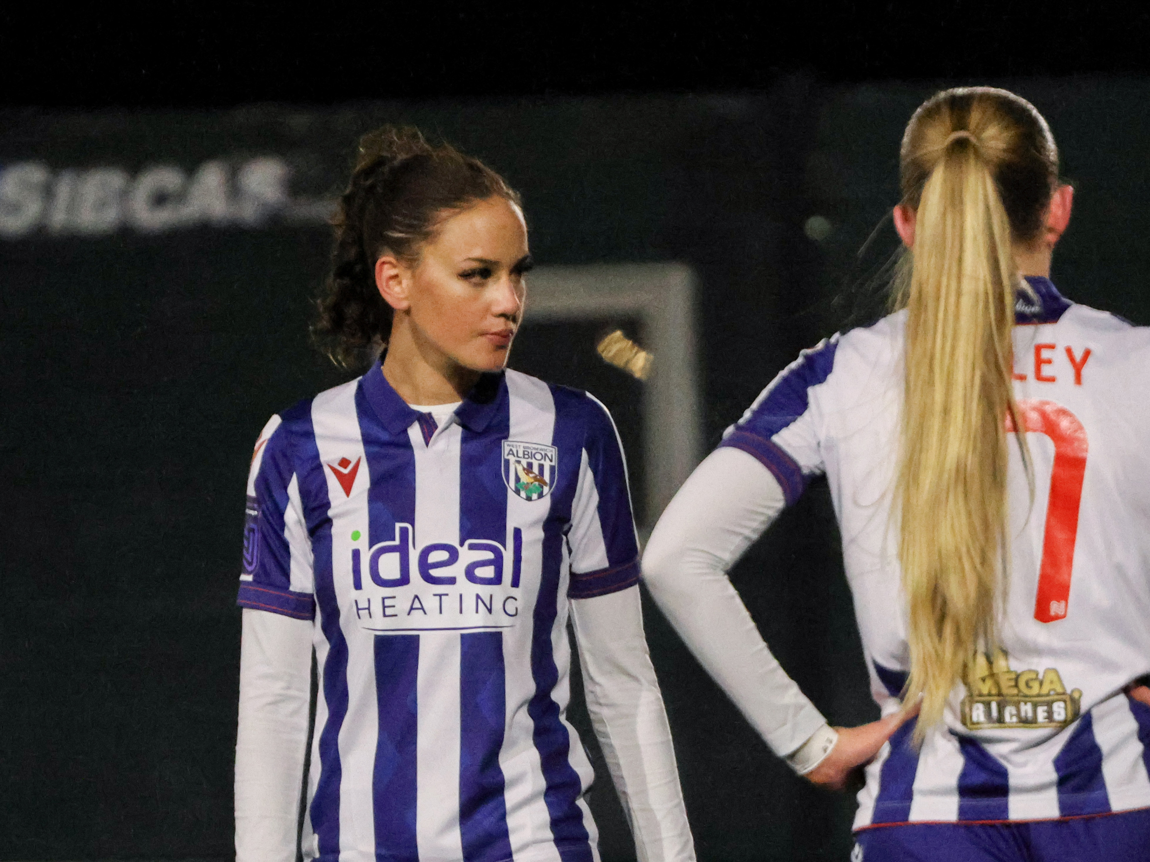 Maddie Oliver in action for Albion Women while wearing the home kit 