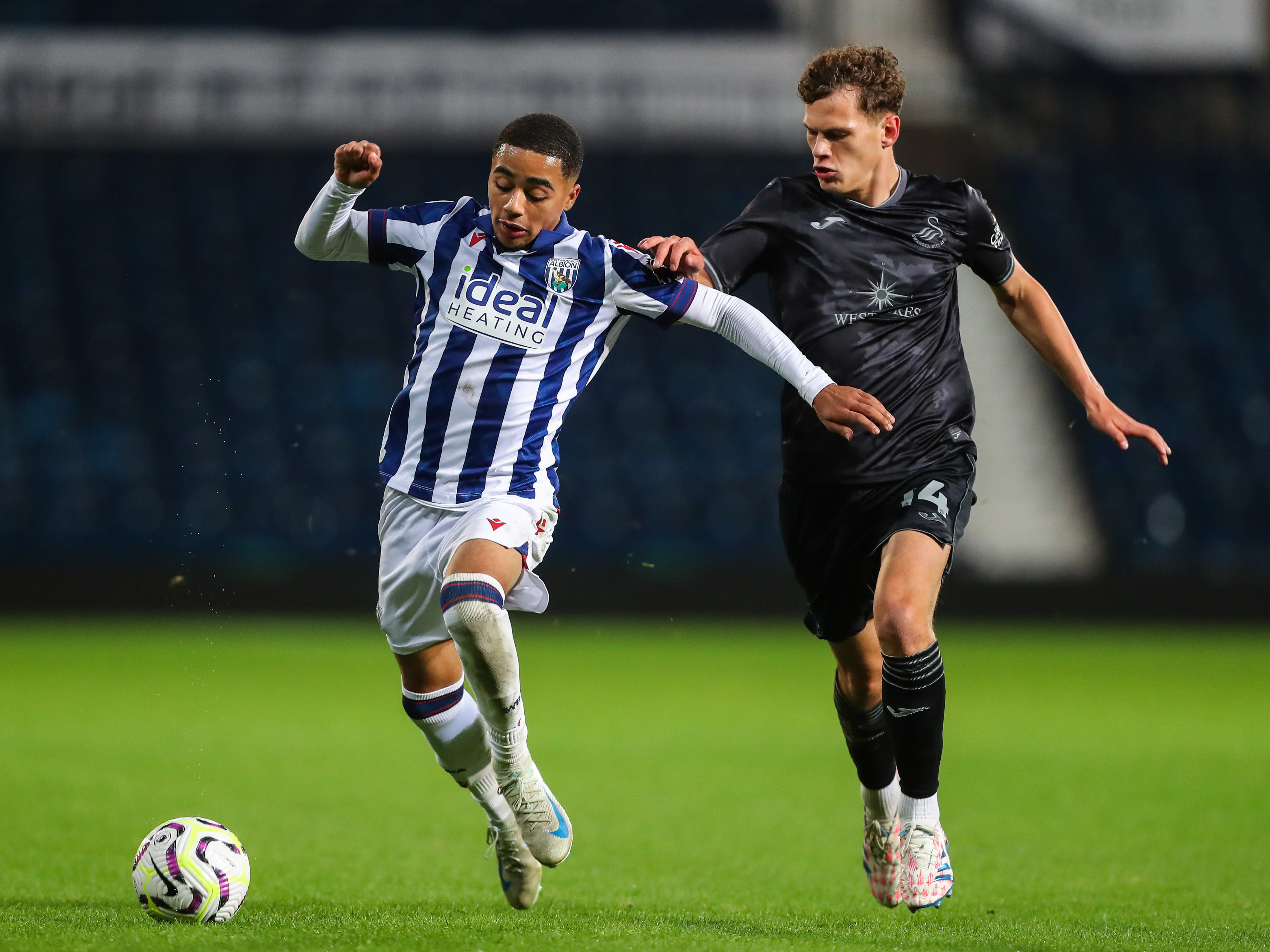 A photo of Albion U21 defender Deago Nelson in action at The Hawthorns, wearing the 2024/25 home kit