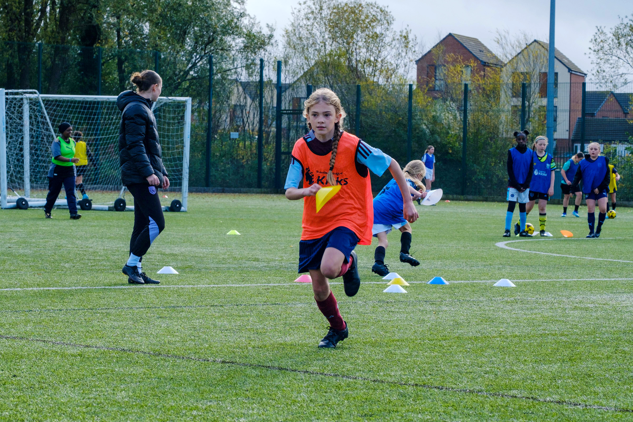 Participant running with cone in hand.