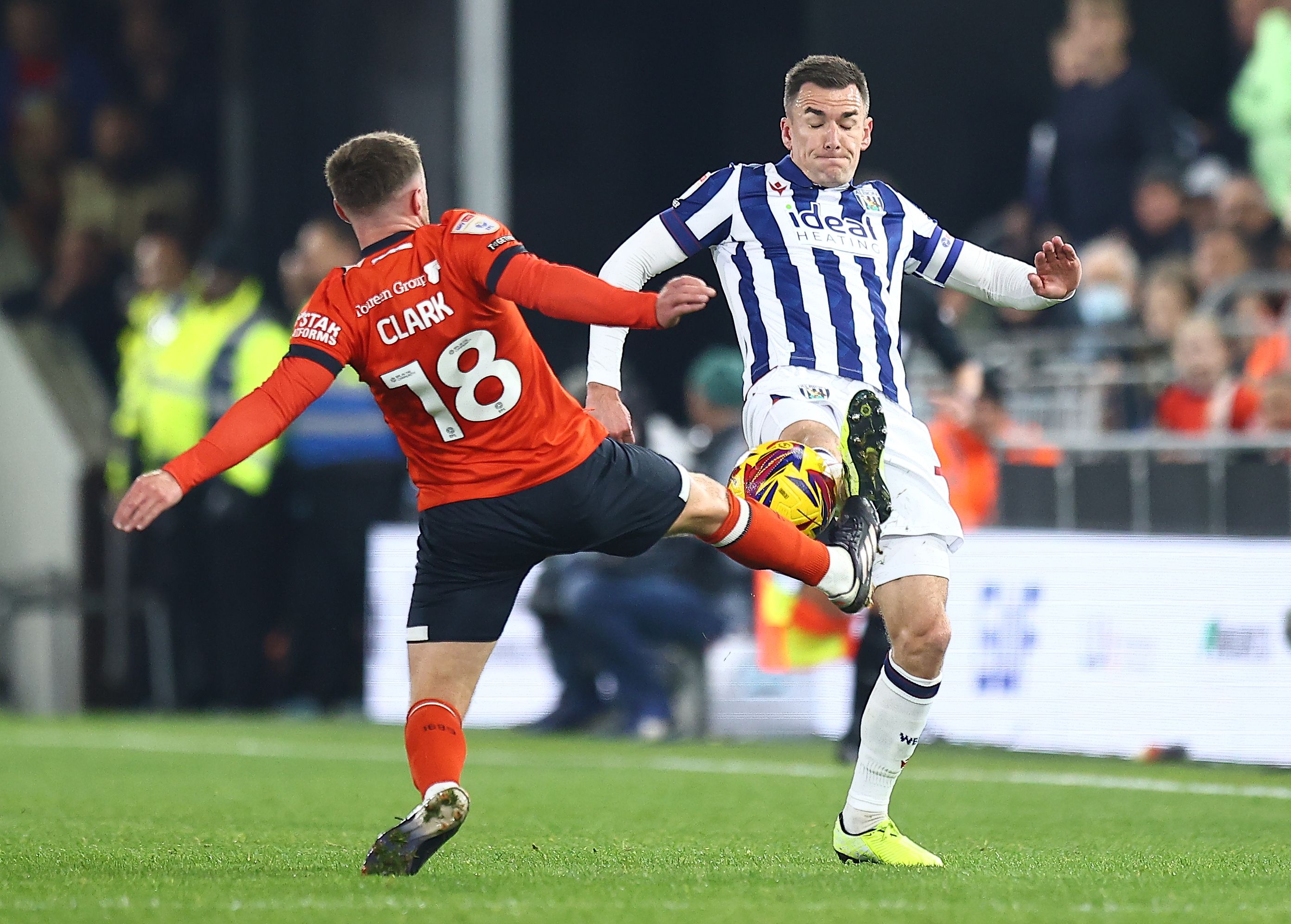 Jed Wallace battles for the ball with a Luton player 