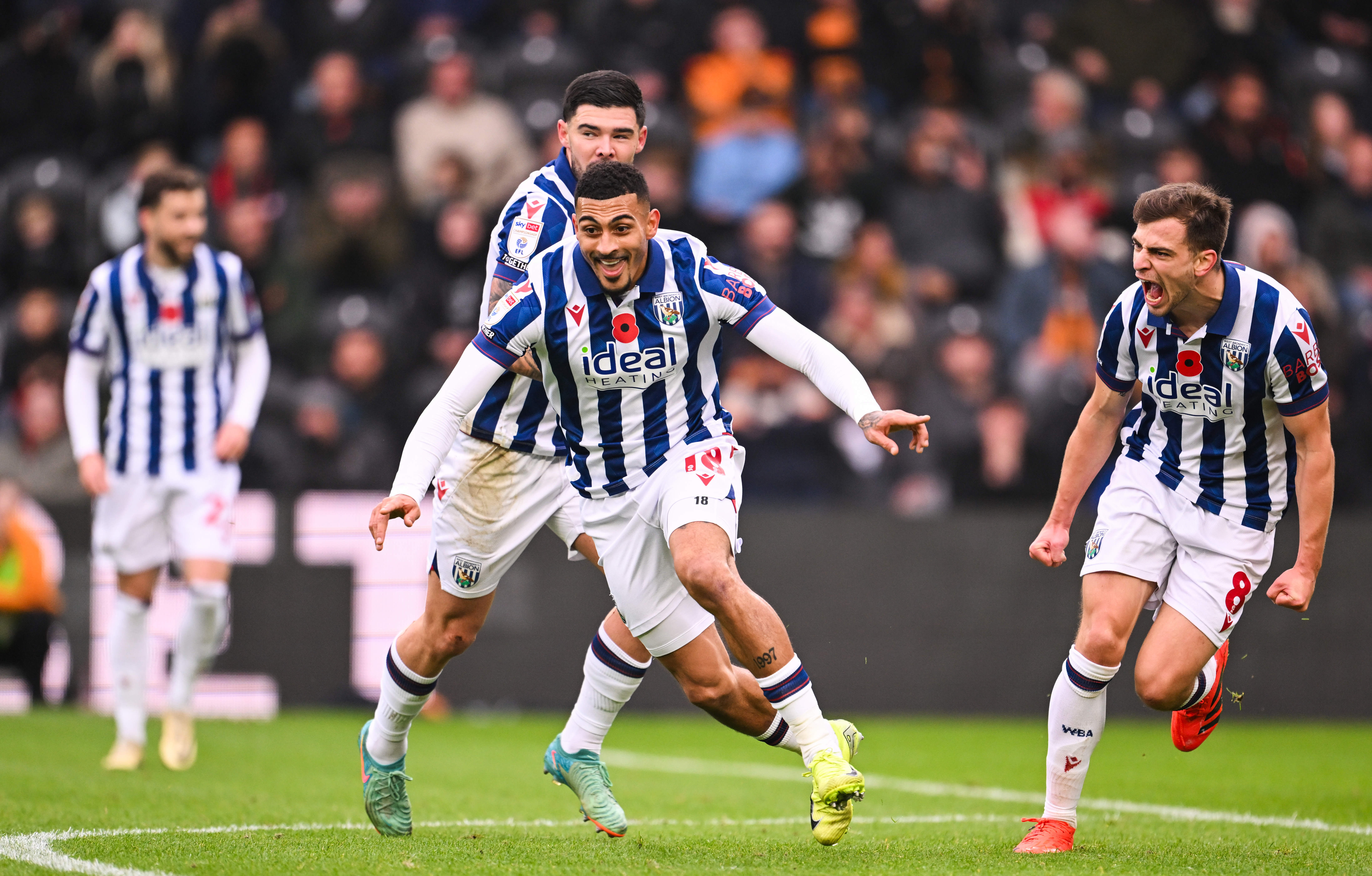 Karlan Grant celebrates scoring against Hull City with team-mates