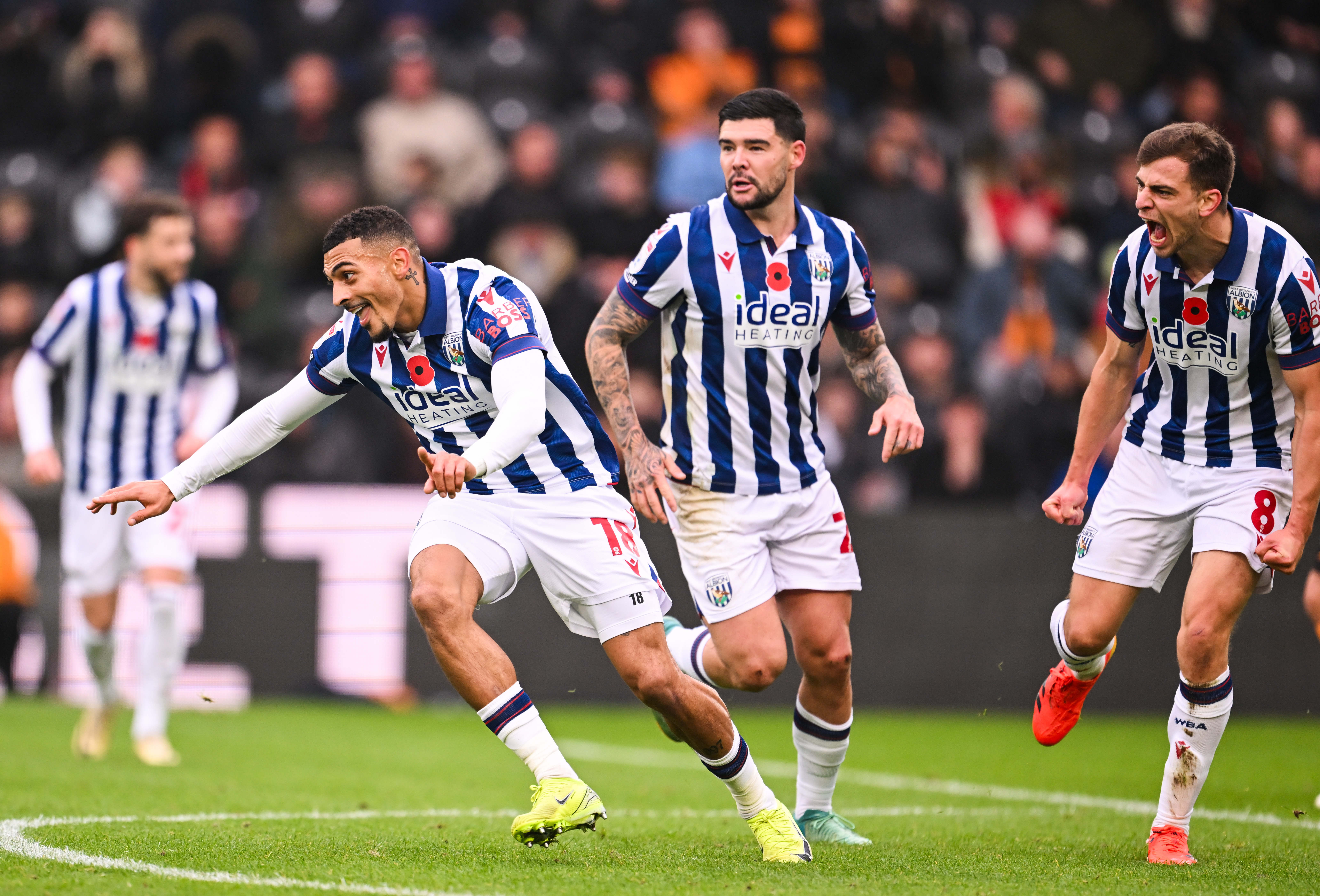 Karlan Grant celebrates scoring against Hull City with team-mates