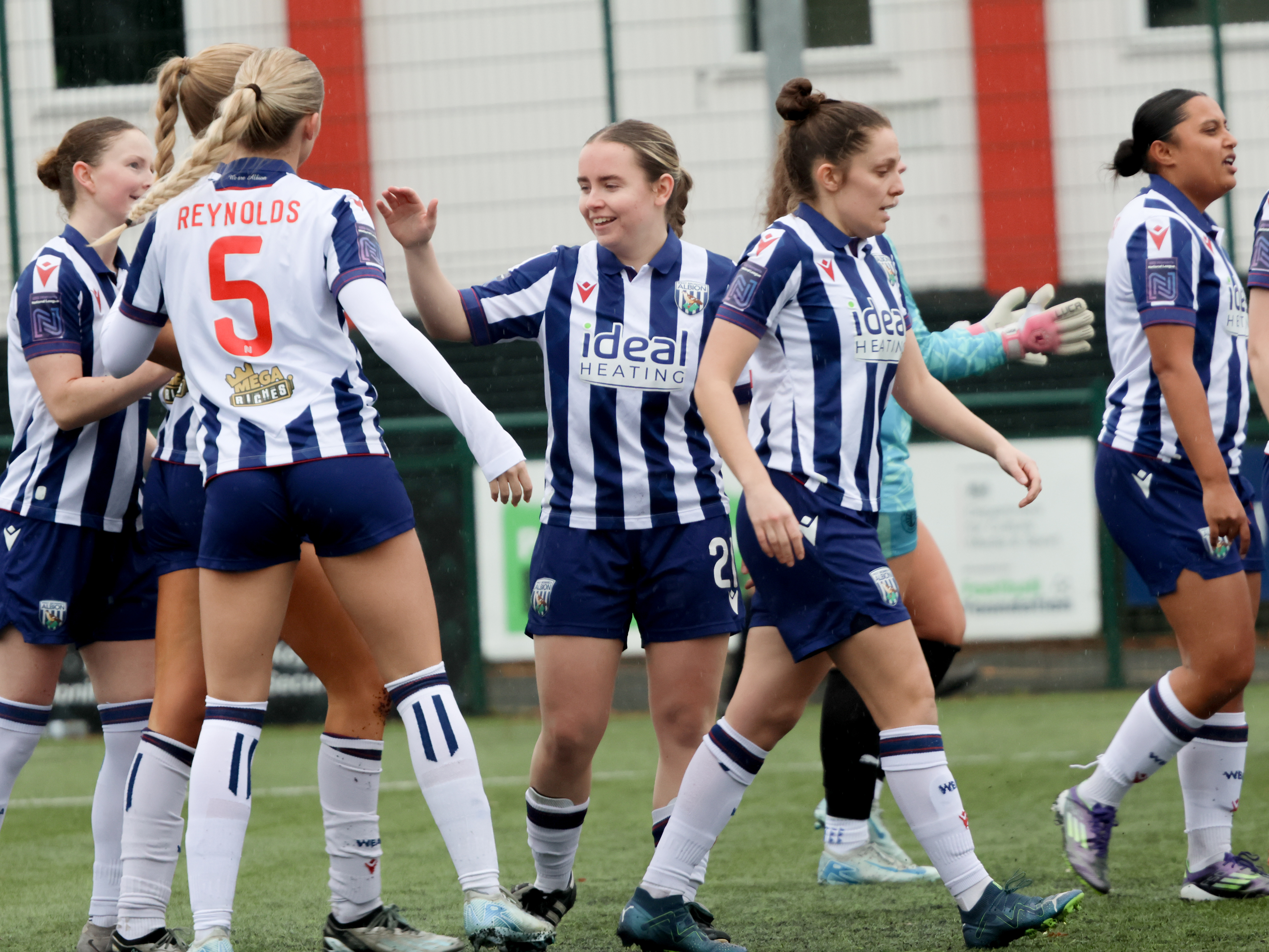 An image of Ella Haughey and the Albion Women team celebrating a goal against Worcester City