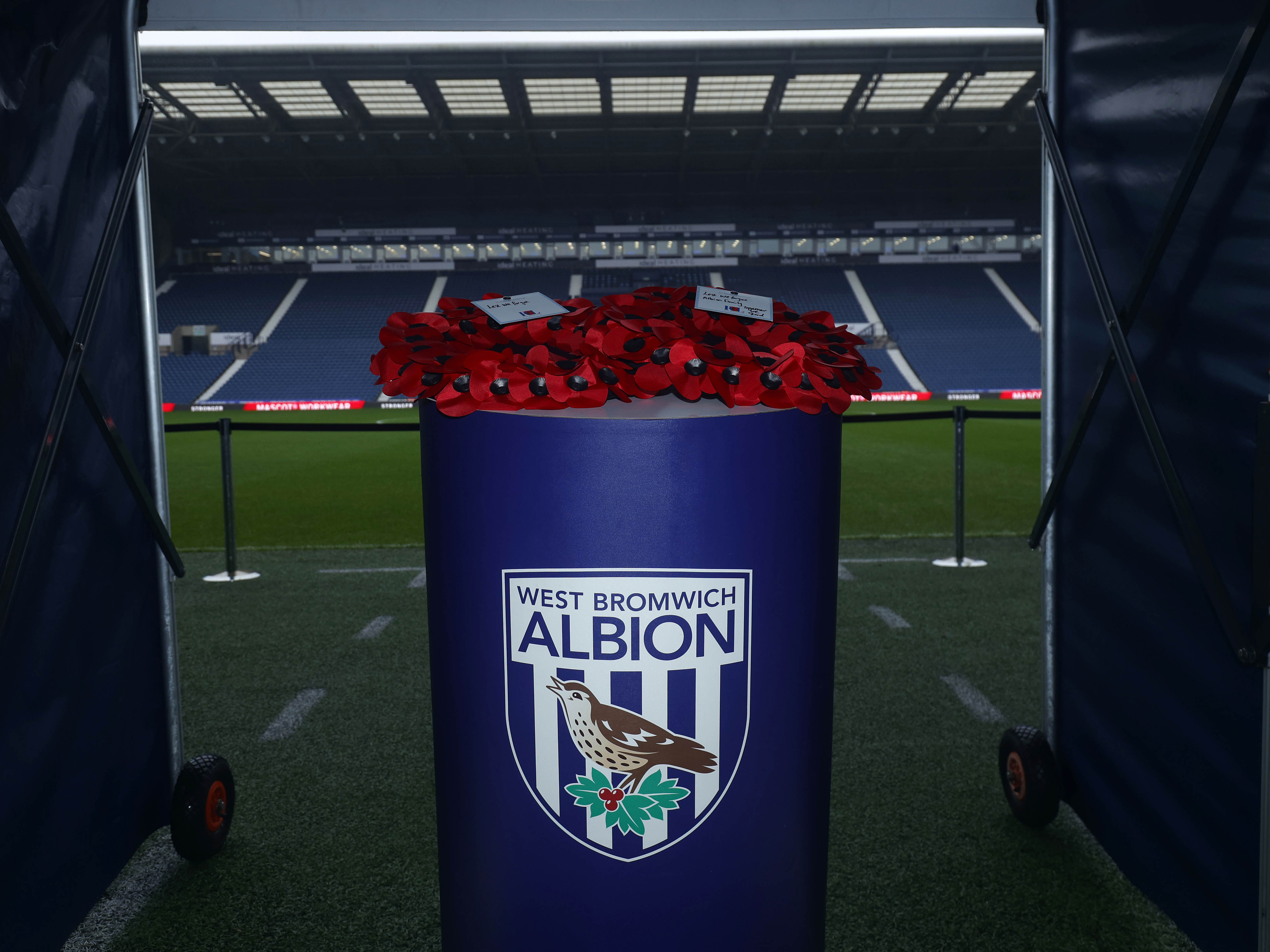 An image of poppy wreaths in the tunnel at The Hawthorns