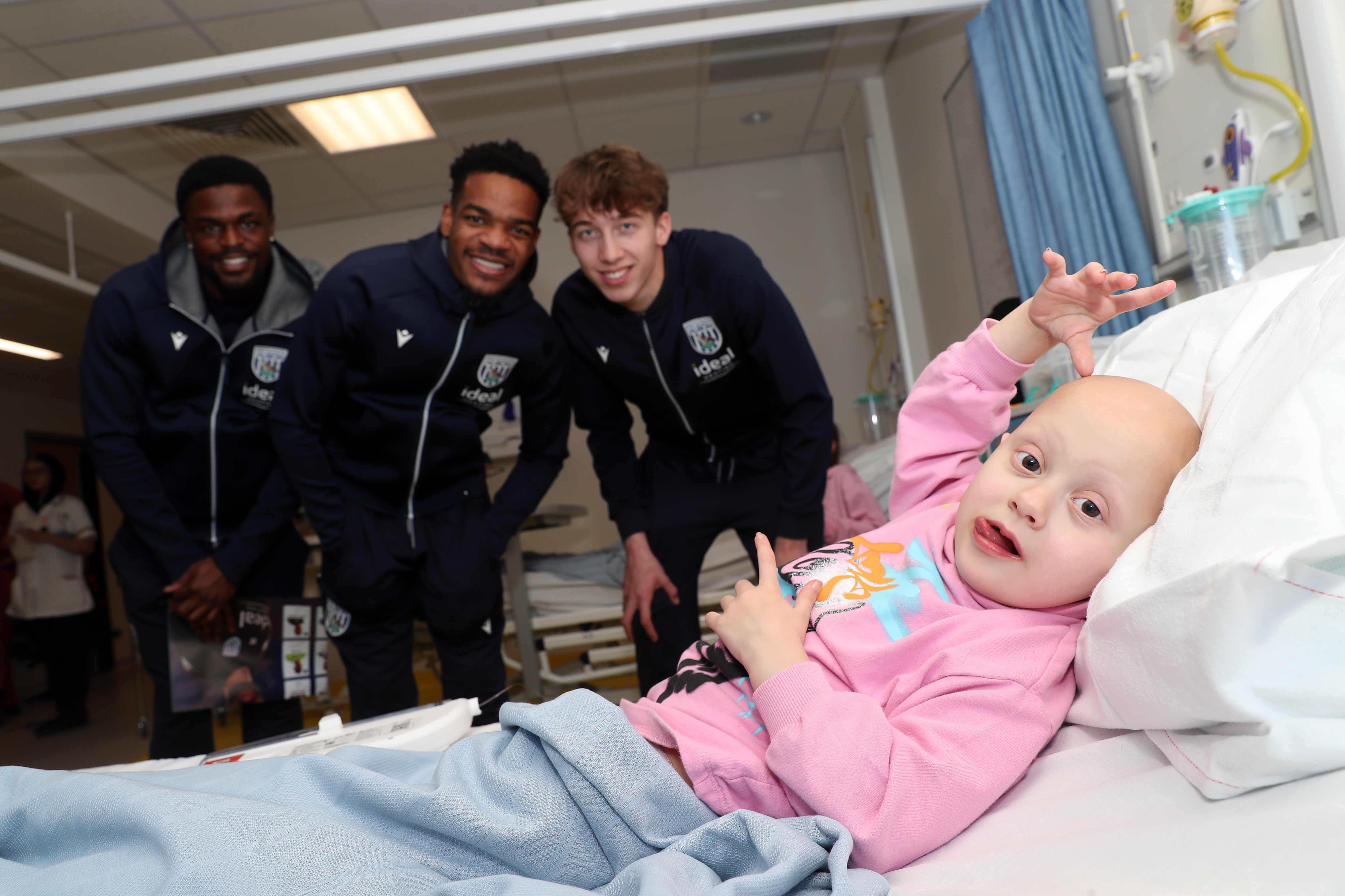 Albion players pose for a photo with a young patient at Midlands Metropolitan University Hospital 