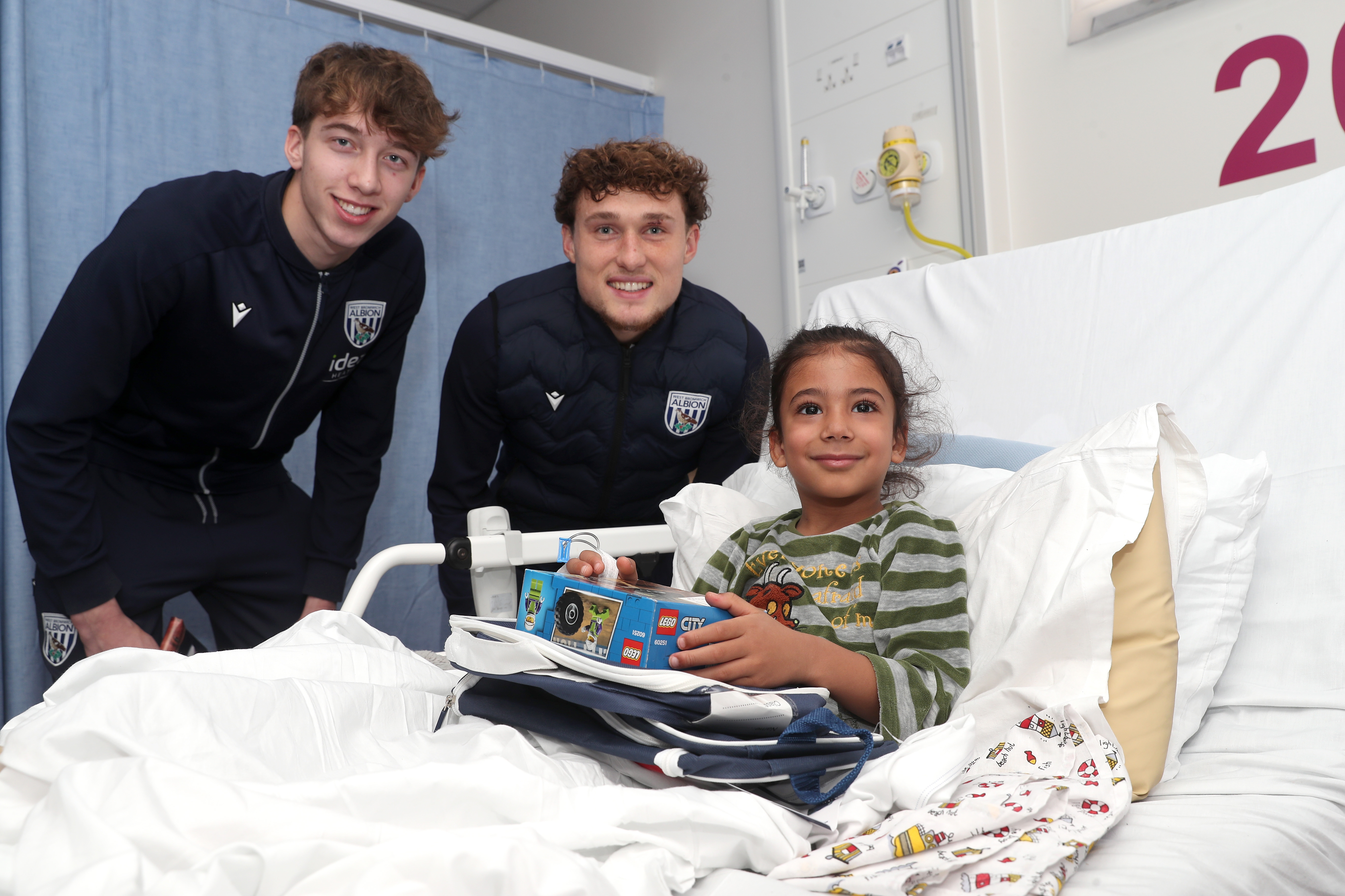 Albion players pose for a photo with a young patient at Midlands Metropolitan University Hospital 