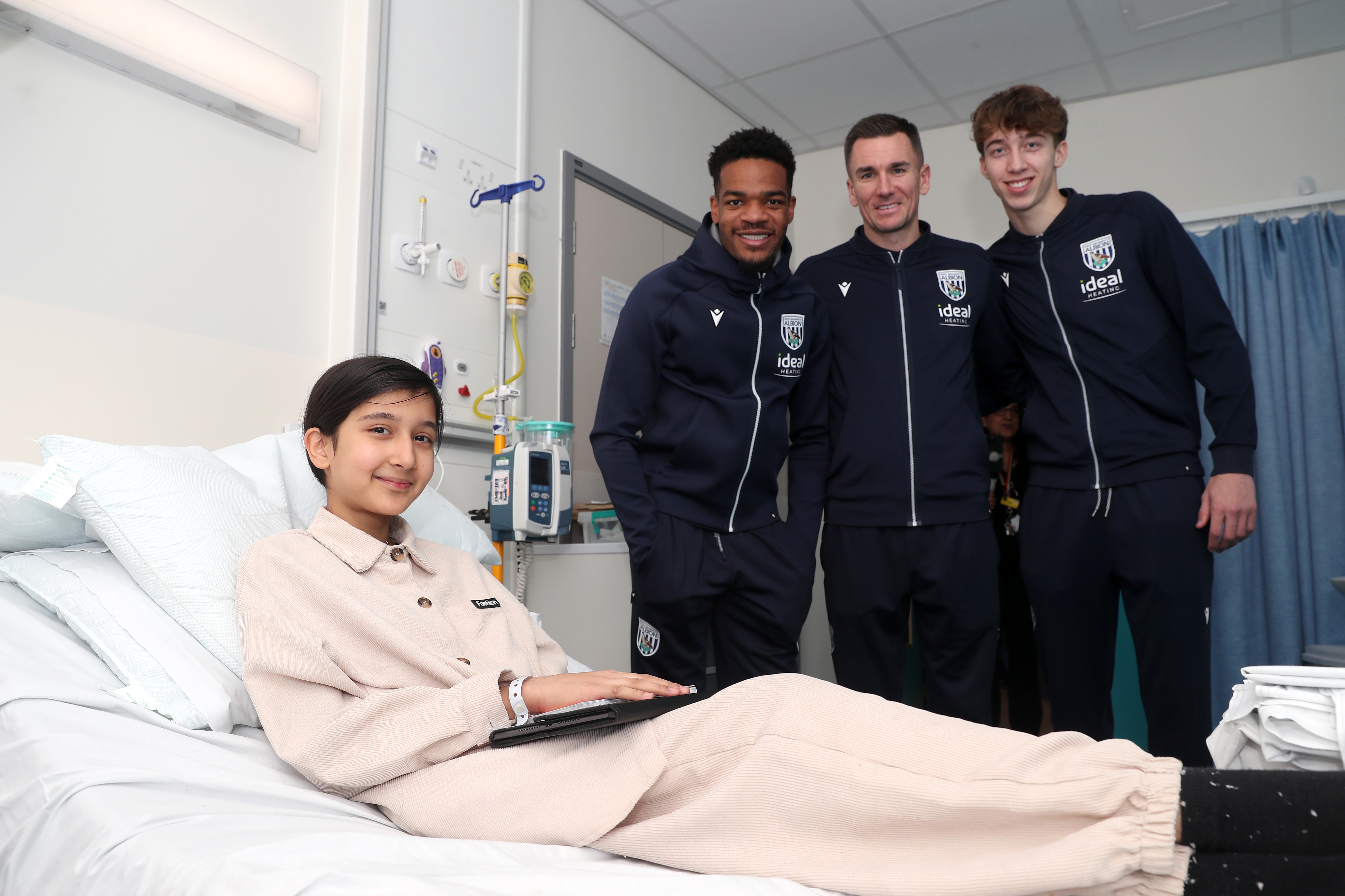 Albion players pose for a photo with a young patient at Midlands Metropolitan University Hospital 