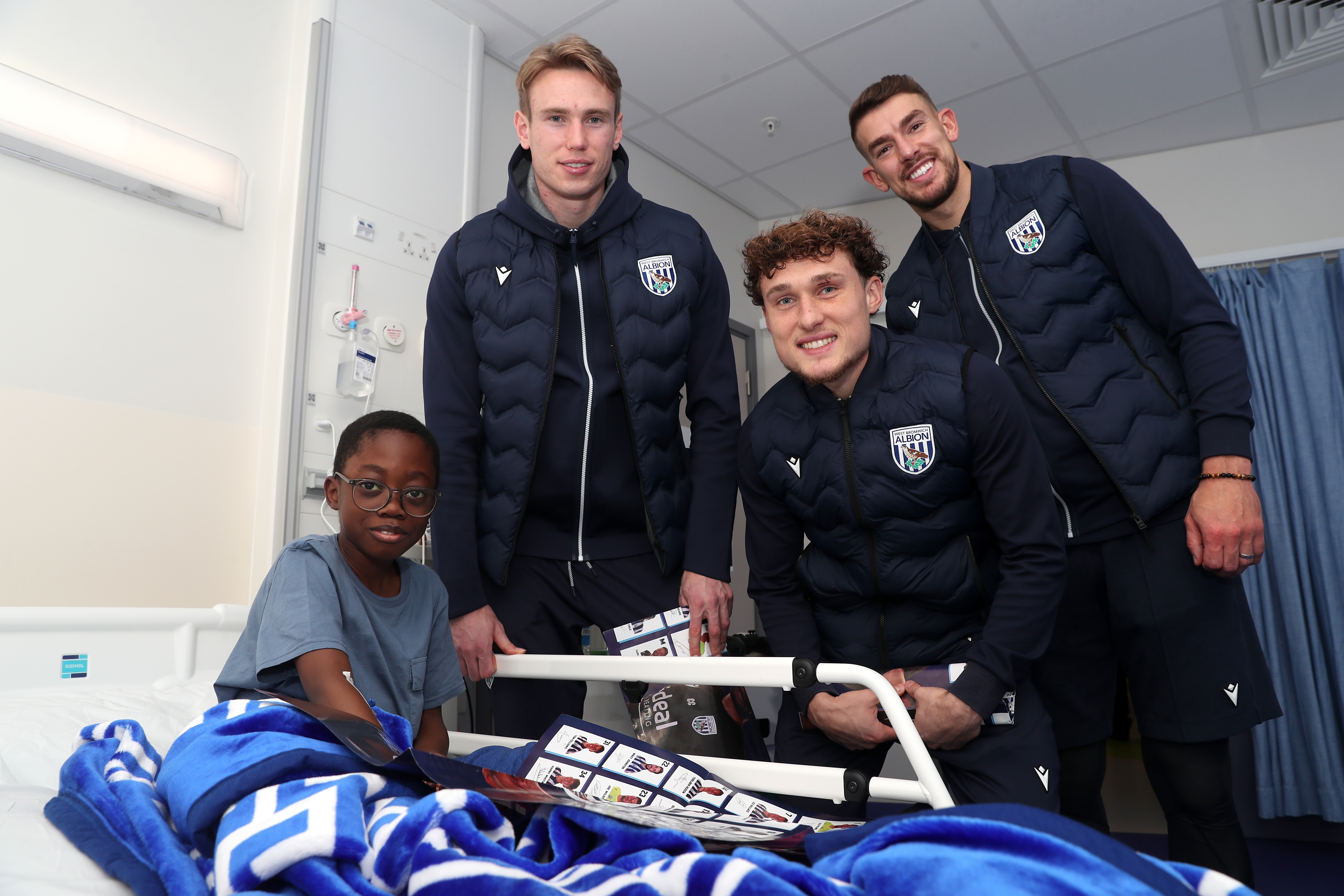 Albion players pose for a photo with a young patient at Midlands Metropolitan University Hospital 