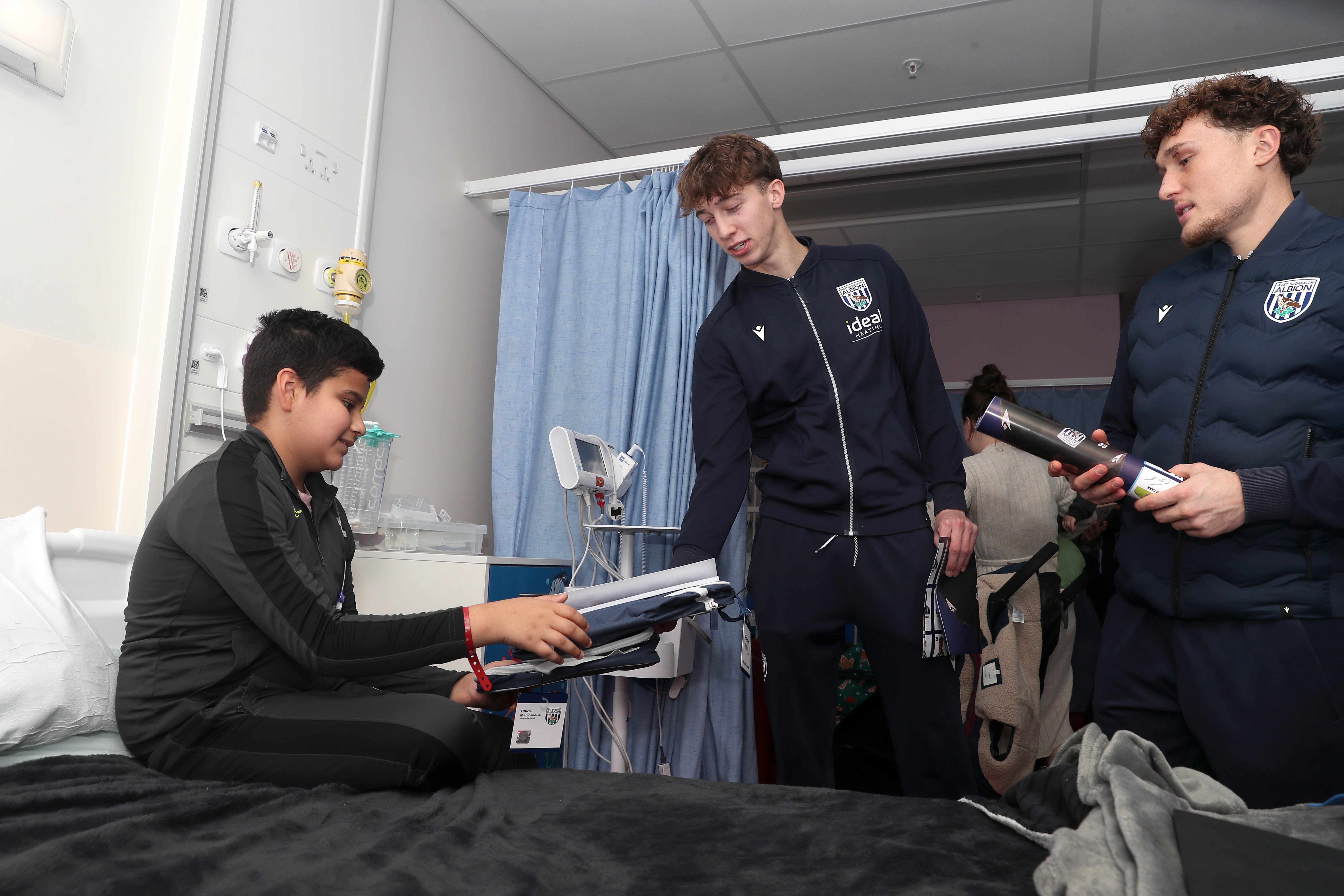 Albion players speak with a young patient at Midlands Metropolitan University Hospital 