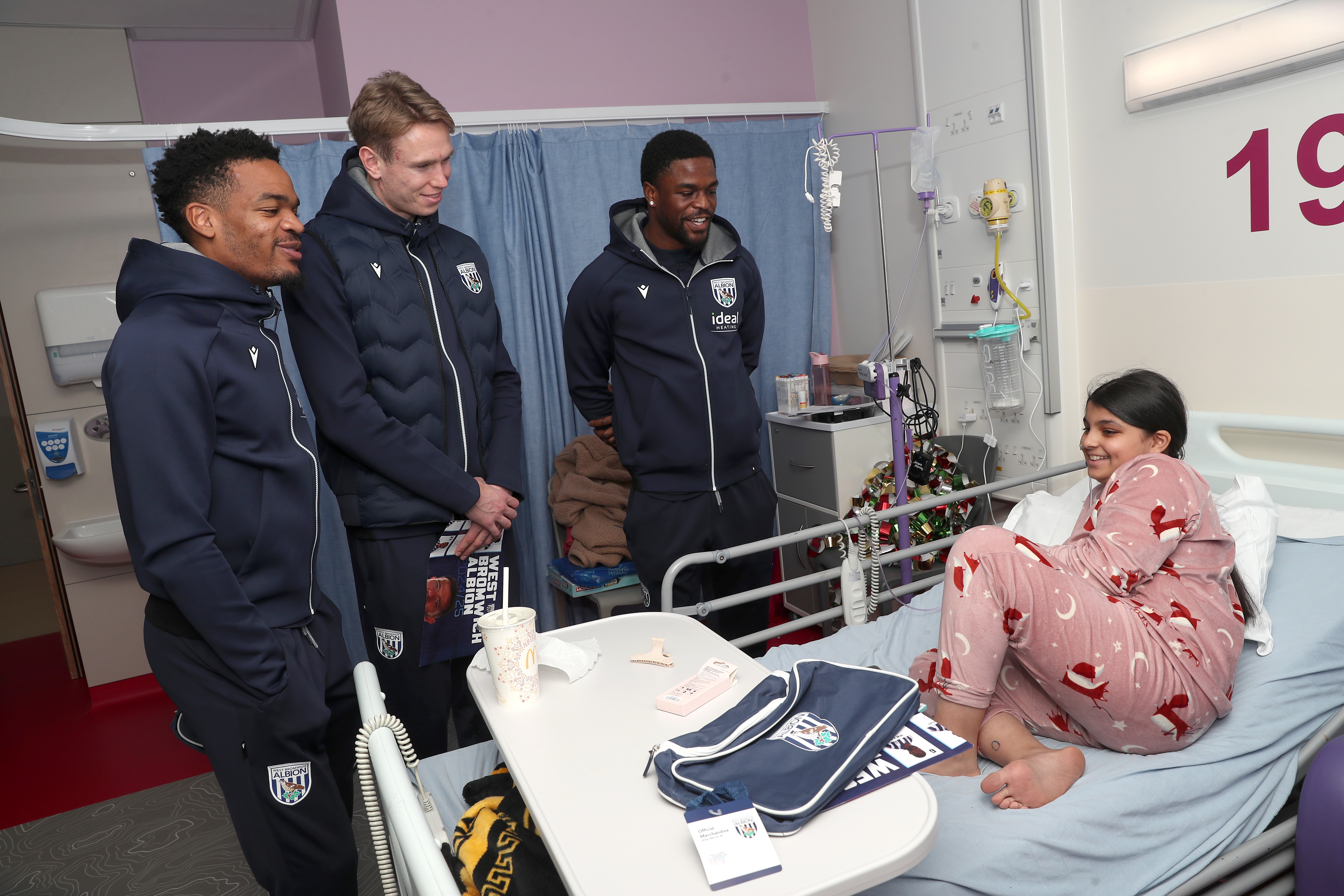 Albion players speak with a young patient at Midlands Metropolitan University Hospital 