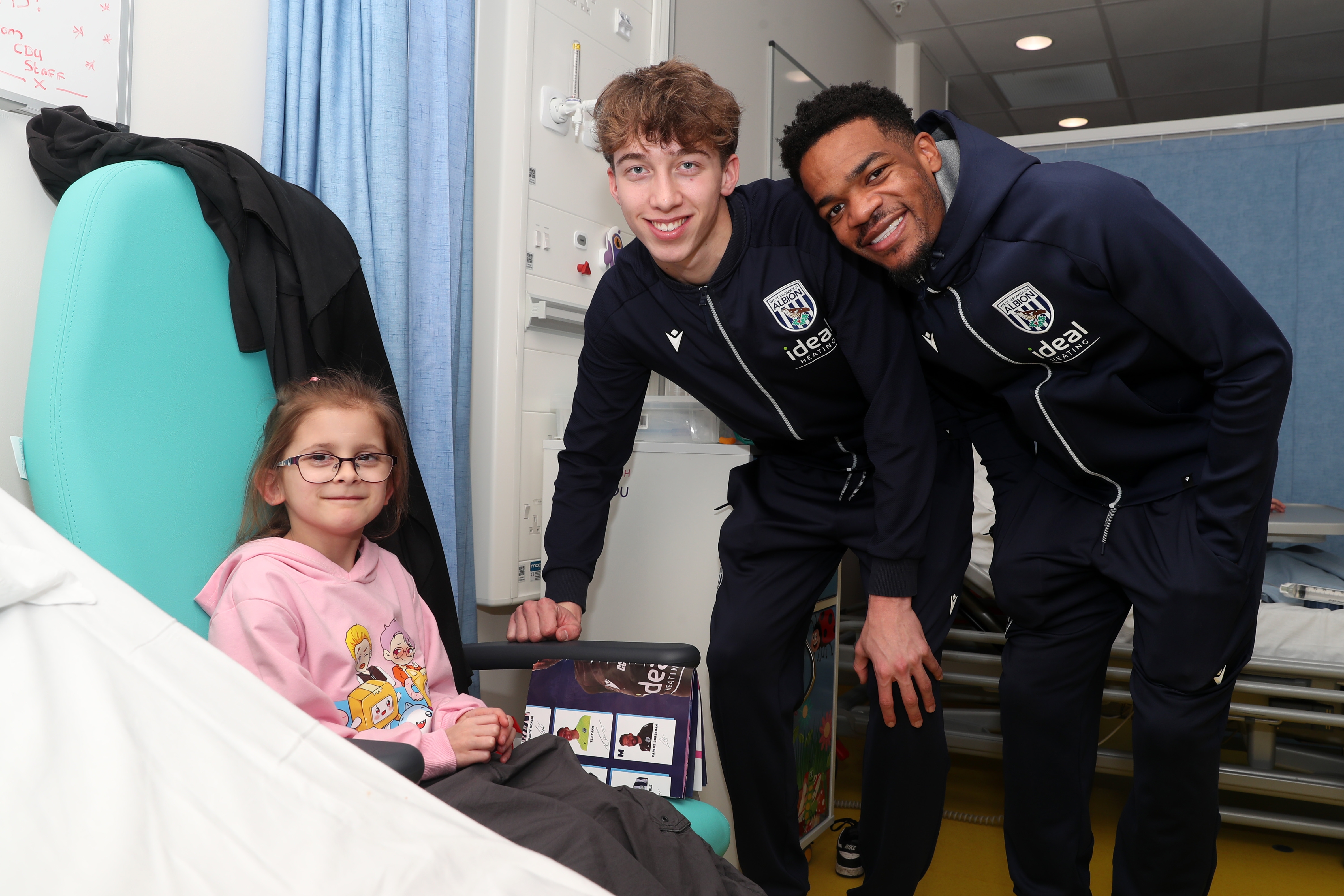 Albion players pose for a photo with a young patient at Midlands Metropolitan University Hospital 