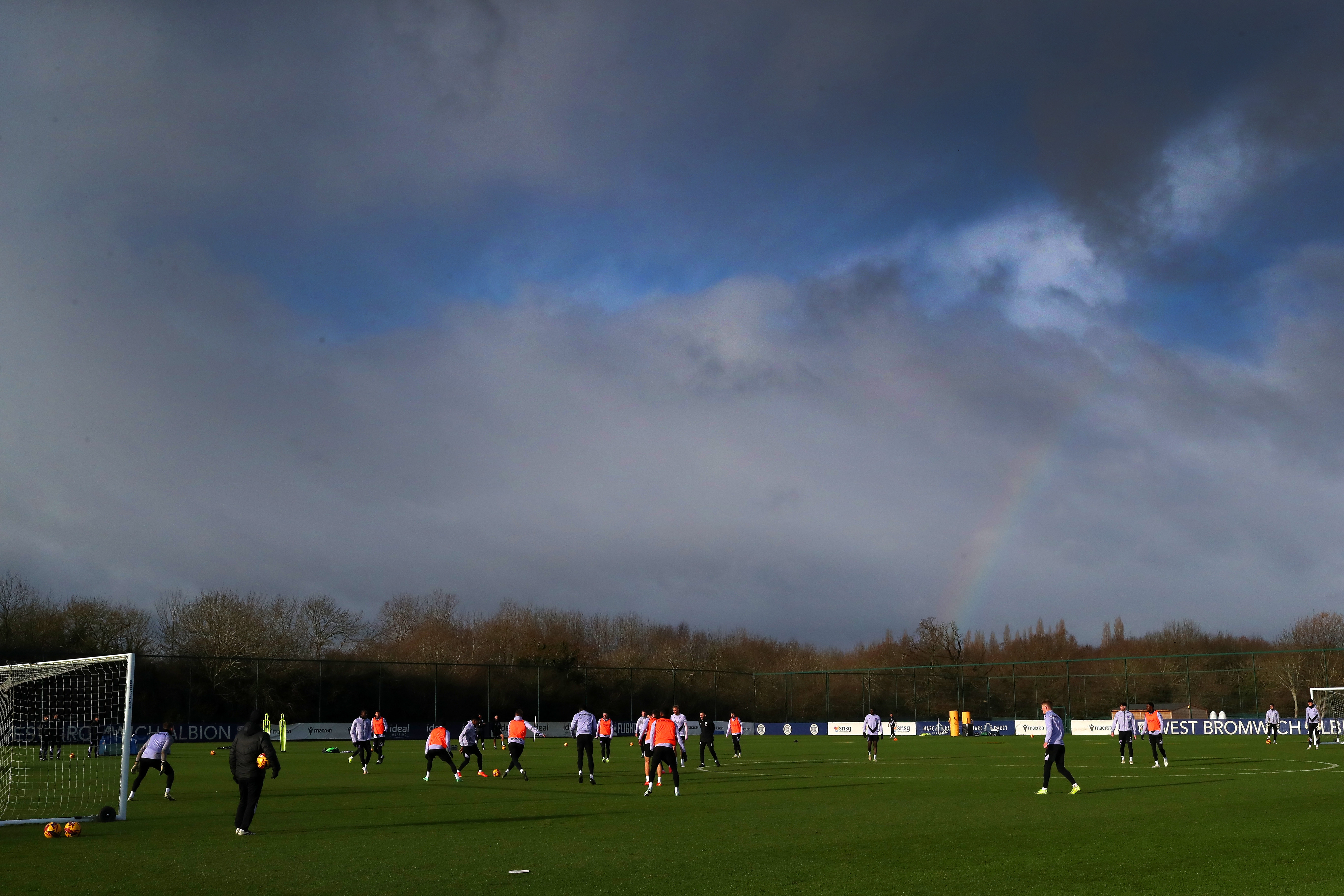 A general view of training with a rainbow in the background 