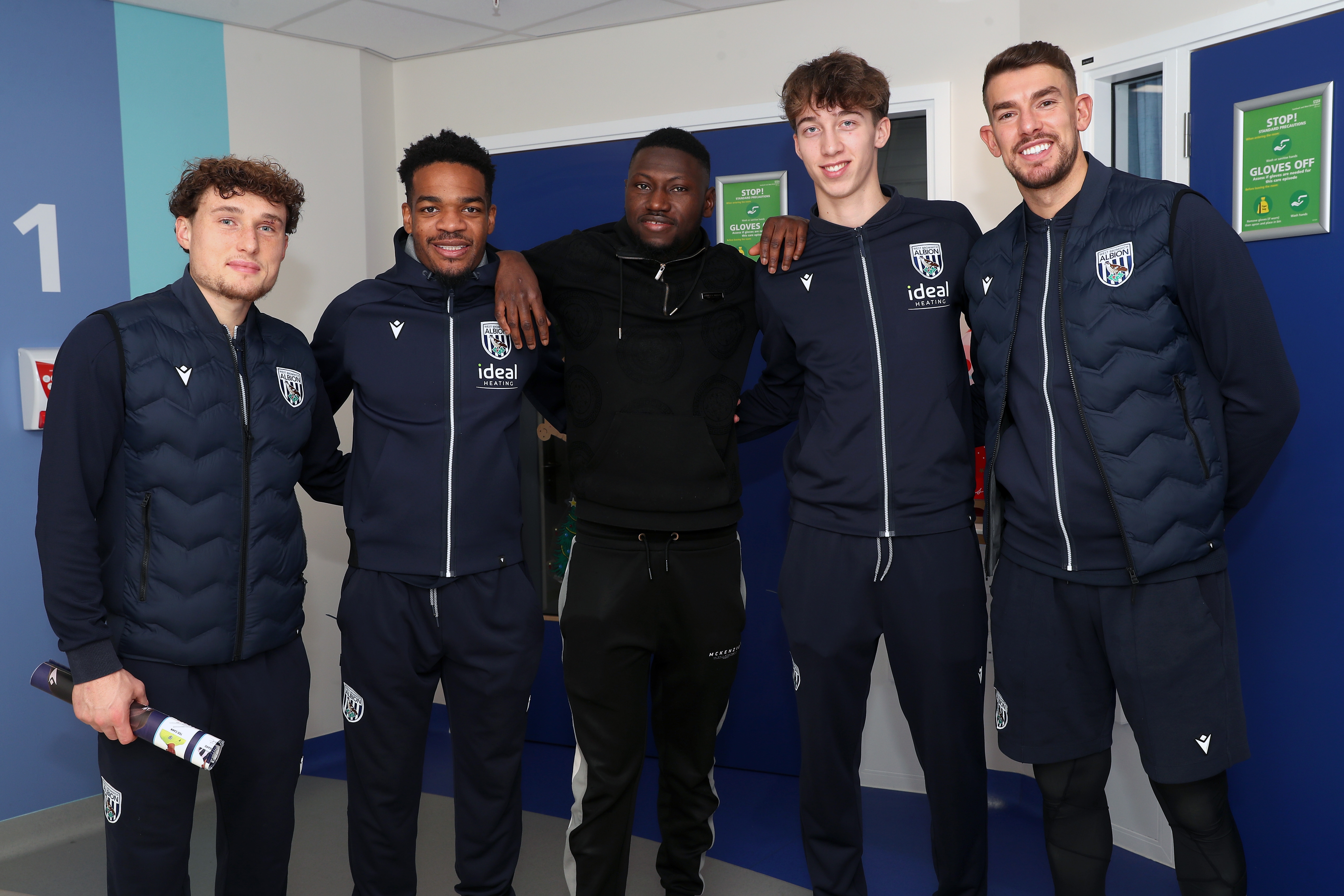 Albion players pose for a photo with a man at Midlands Metropolitan University Hospital 