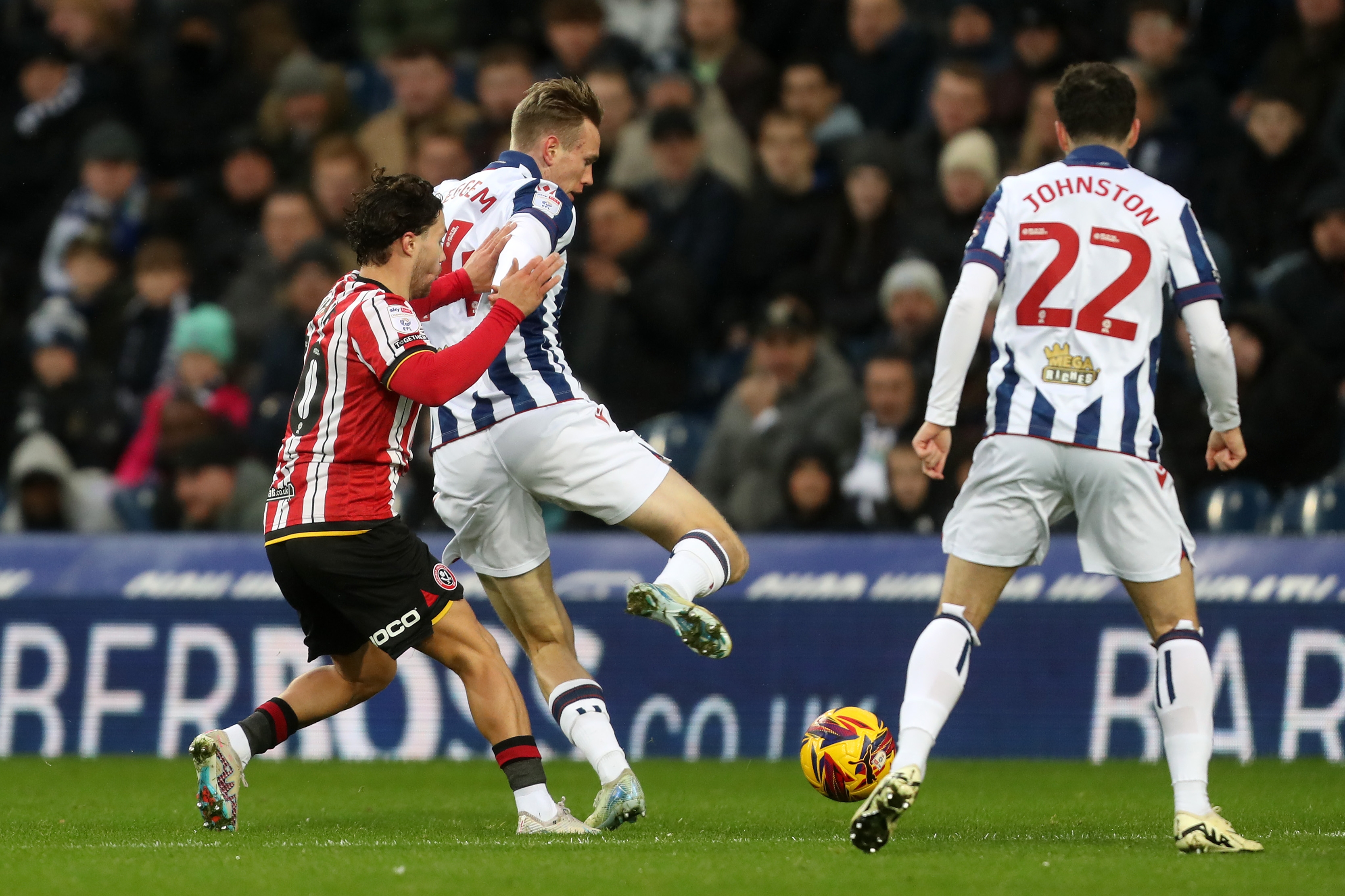 Torbjørn Heggem battling for the ball against Sheffield United in the home kit 