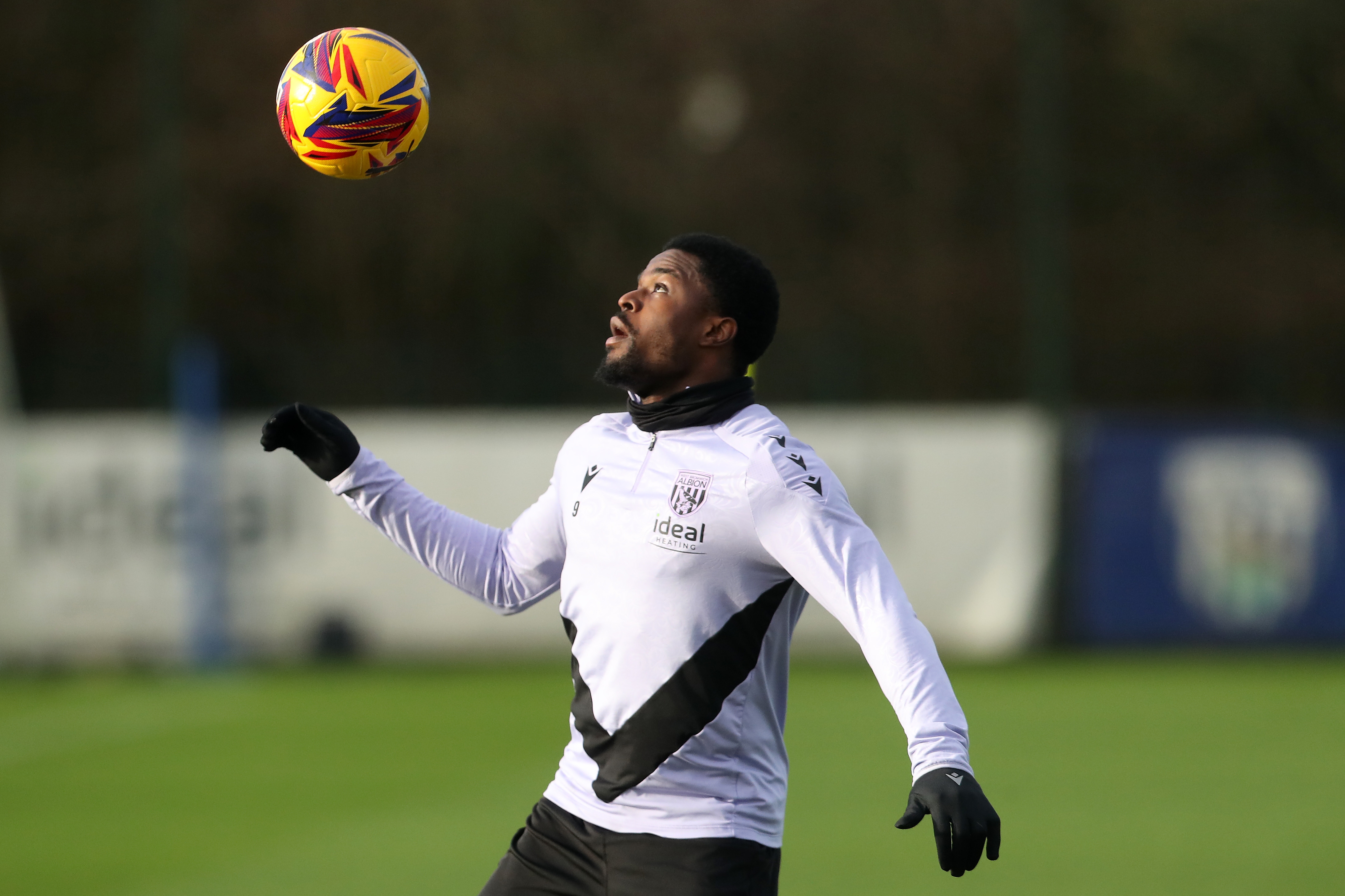 Josh Maja watches the ball in the air in training 