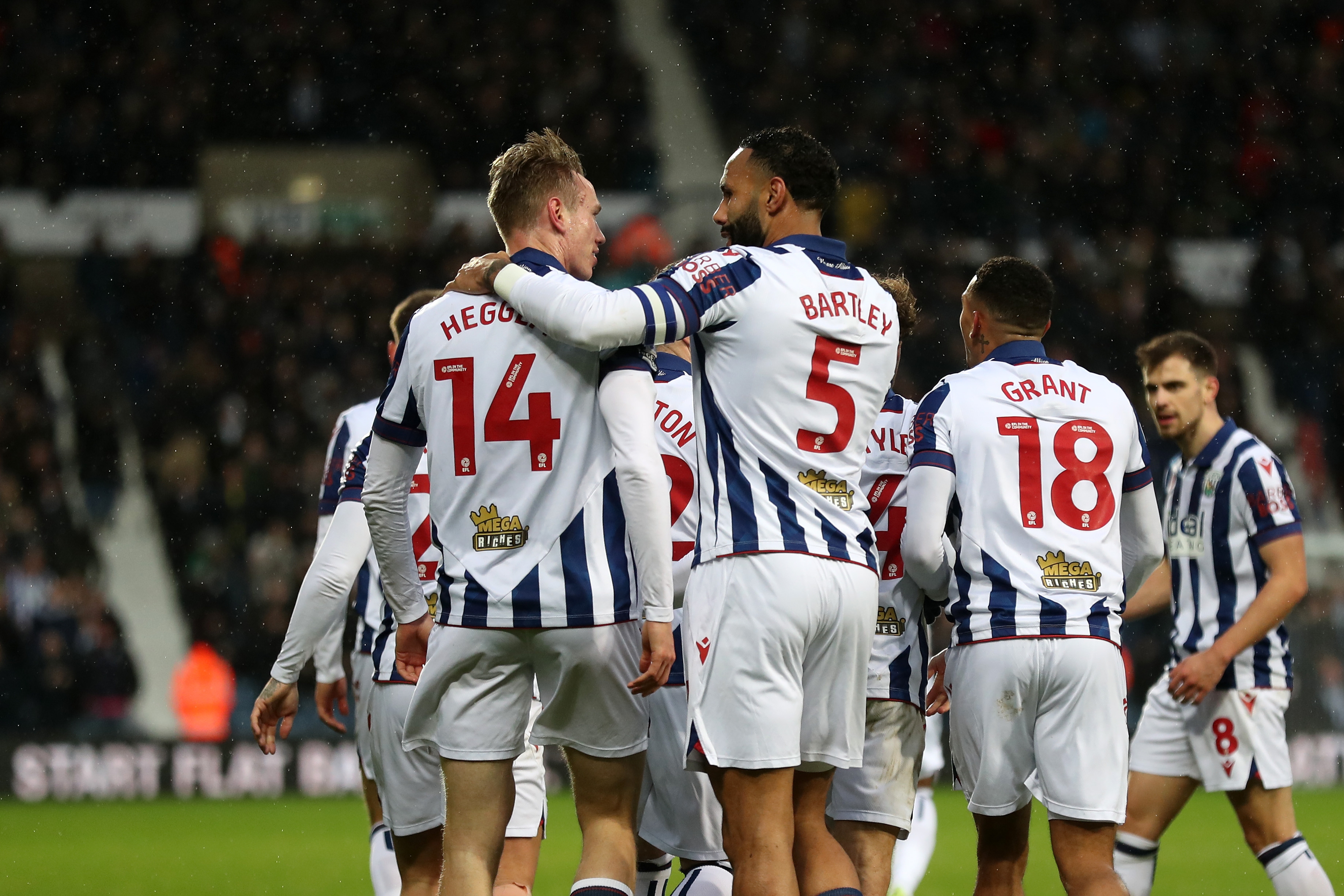 Torbjørn Heggem celebrates scoring a header against Sheffield United with team-mates 