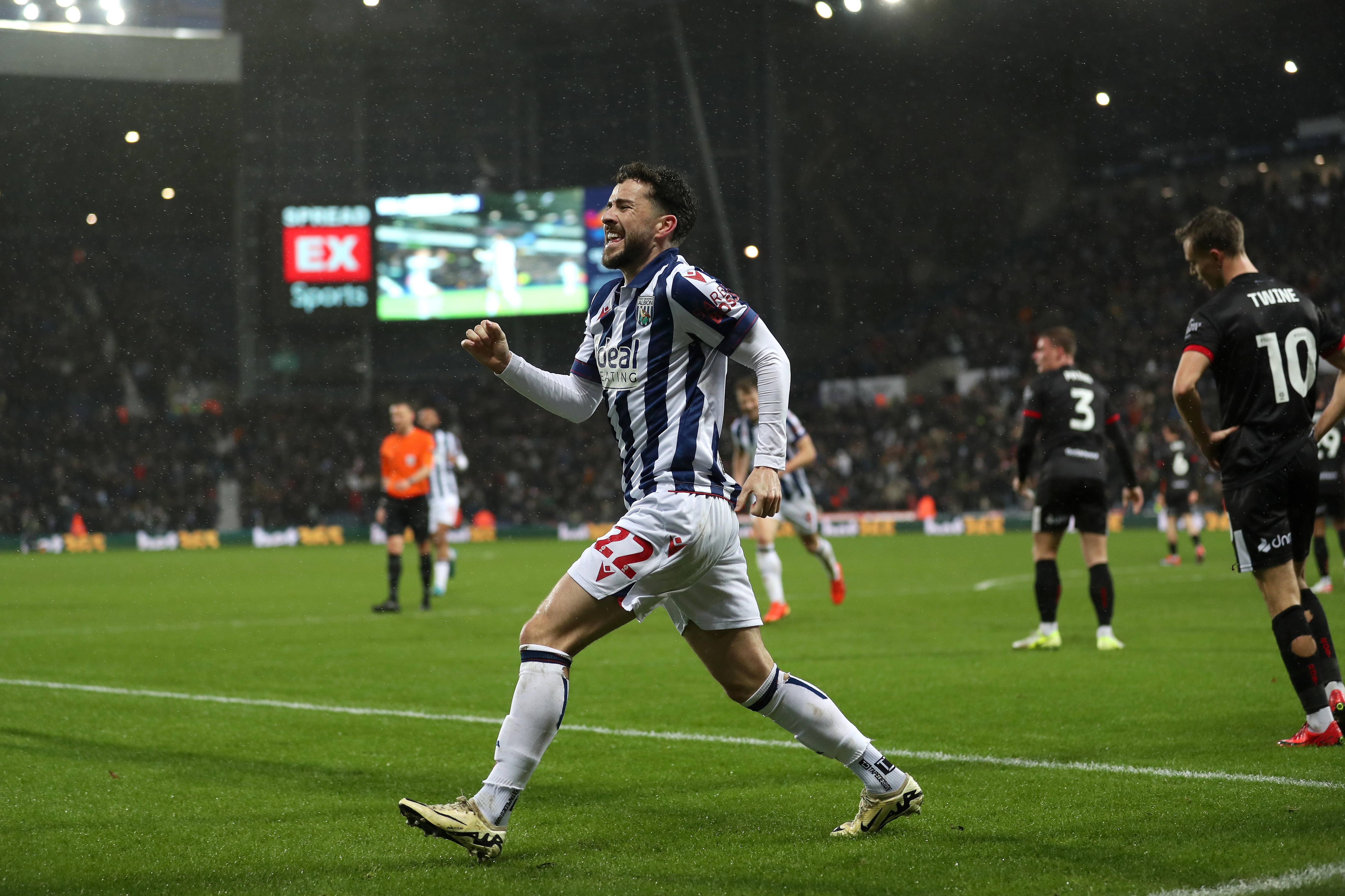 Mikey Johnston celebrates scoring a header against Bristol City 