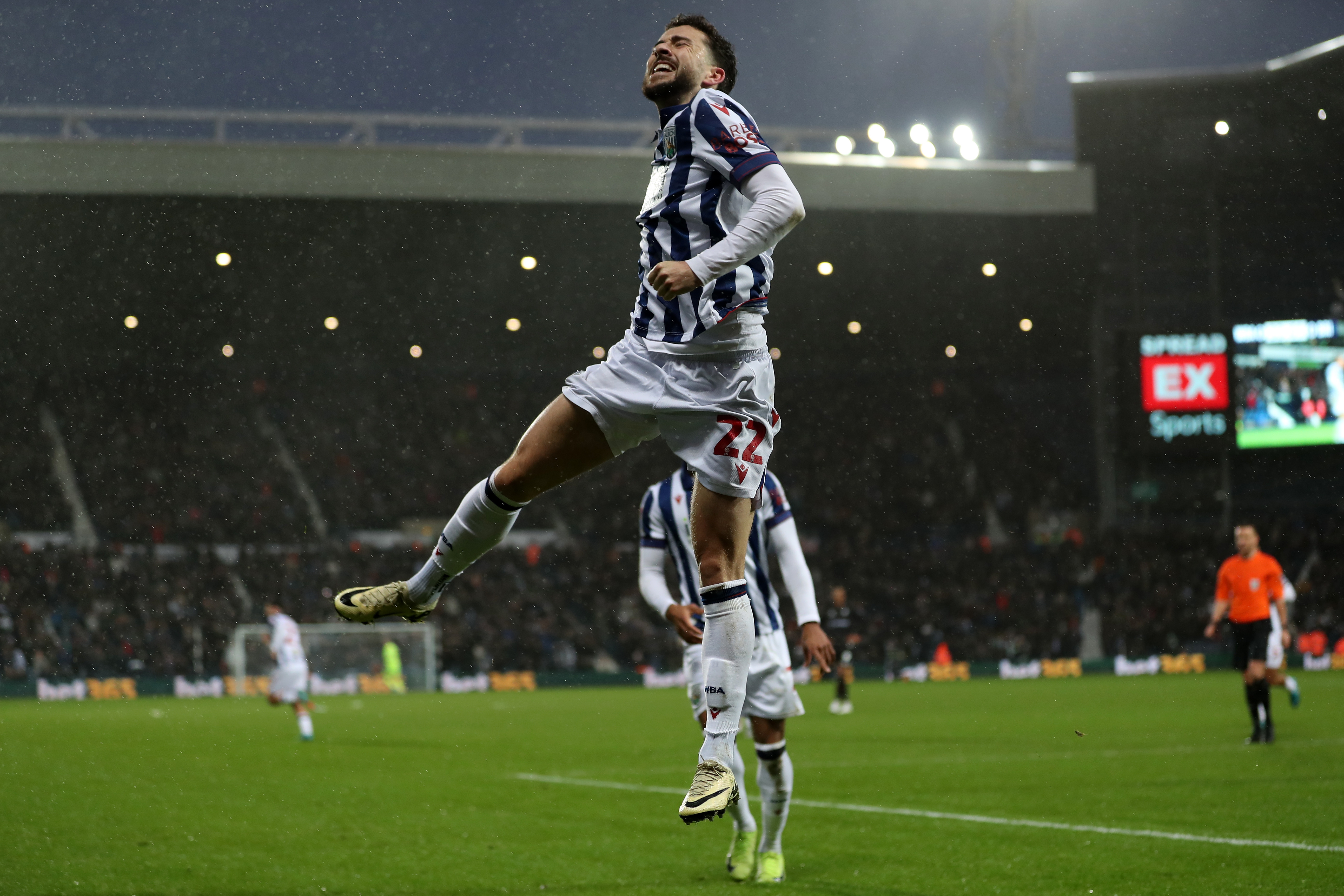 Mikey Johnston celebrates scoring a header against Bristol City 