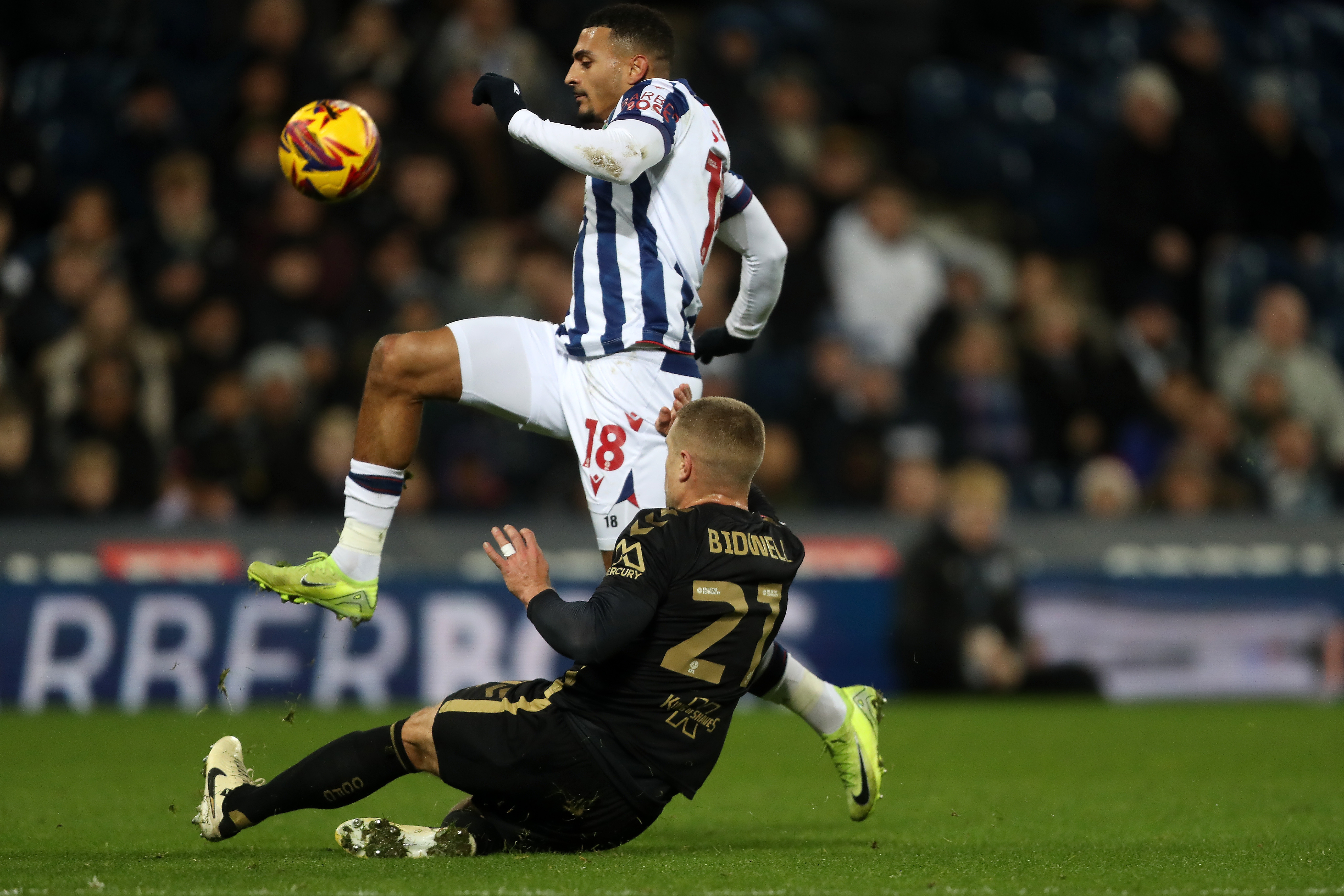 Karlan Grant is tackled by a Coventry City player 