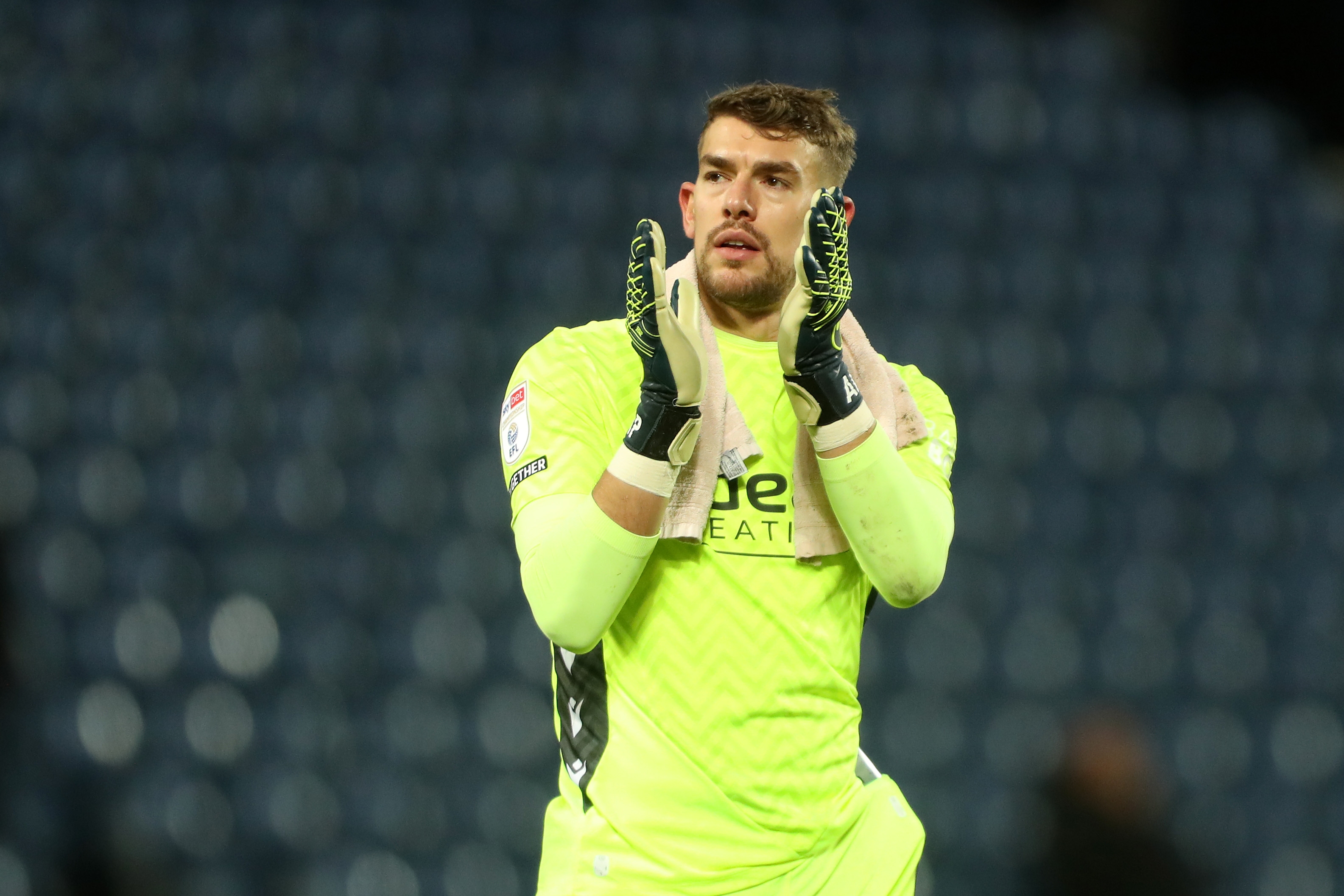 Alex Palmer applauds Albion fans following the win over Bristol City