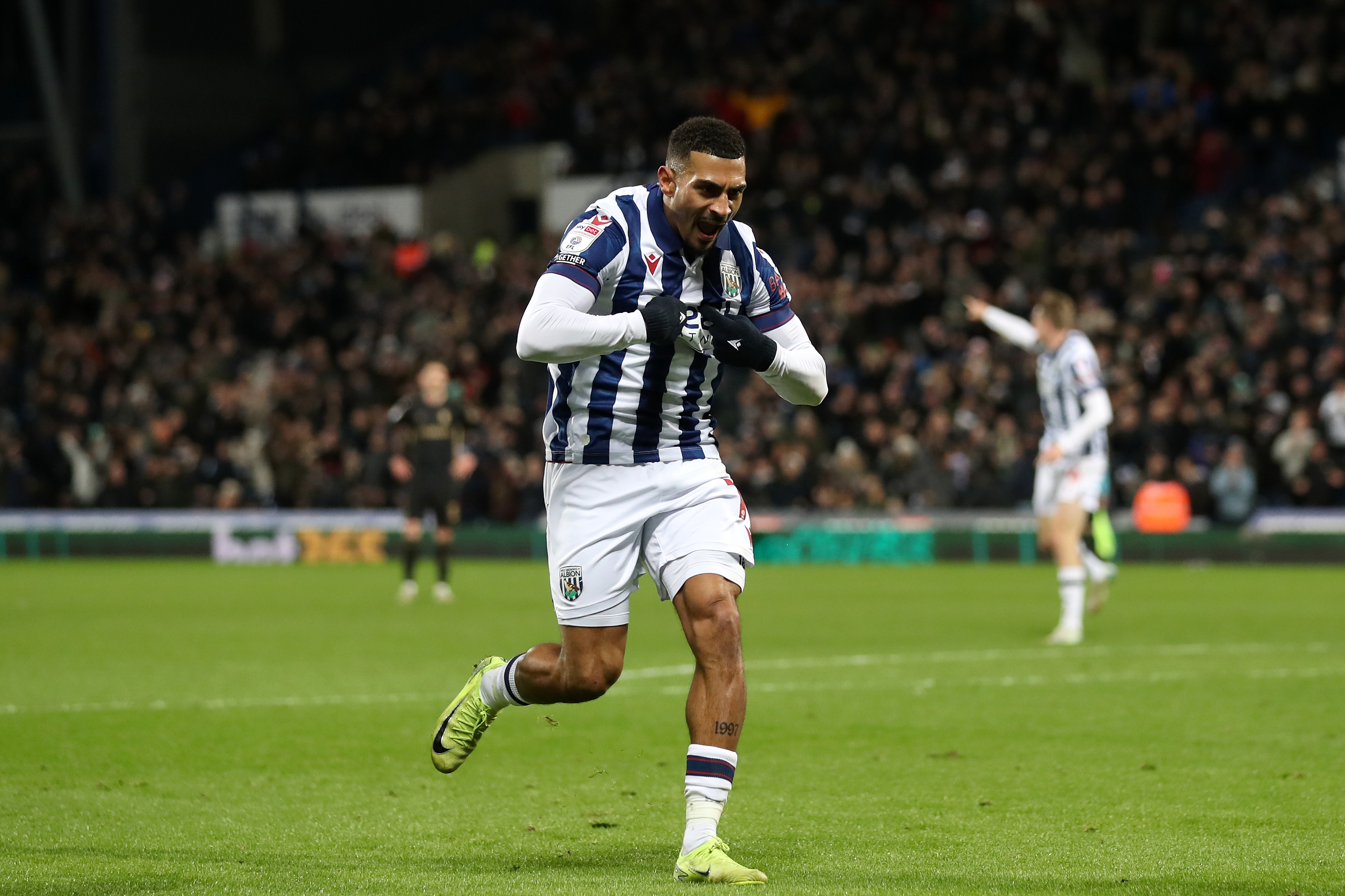 Karlan Grant celebrates scoring against Coventry City