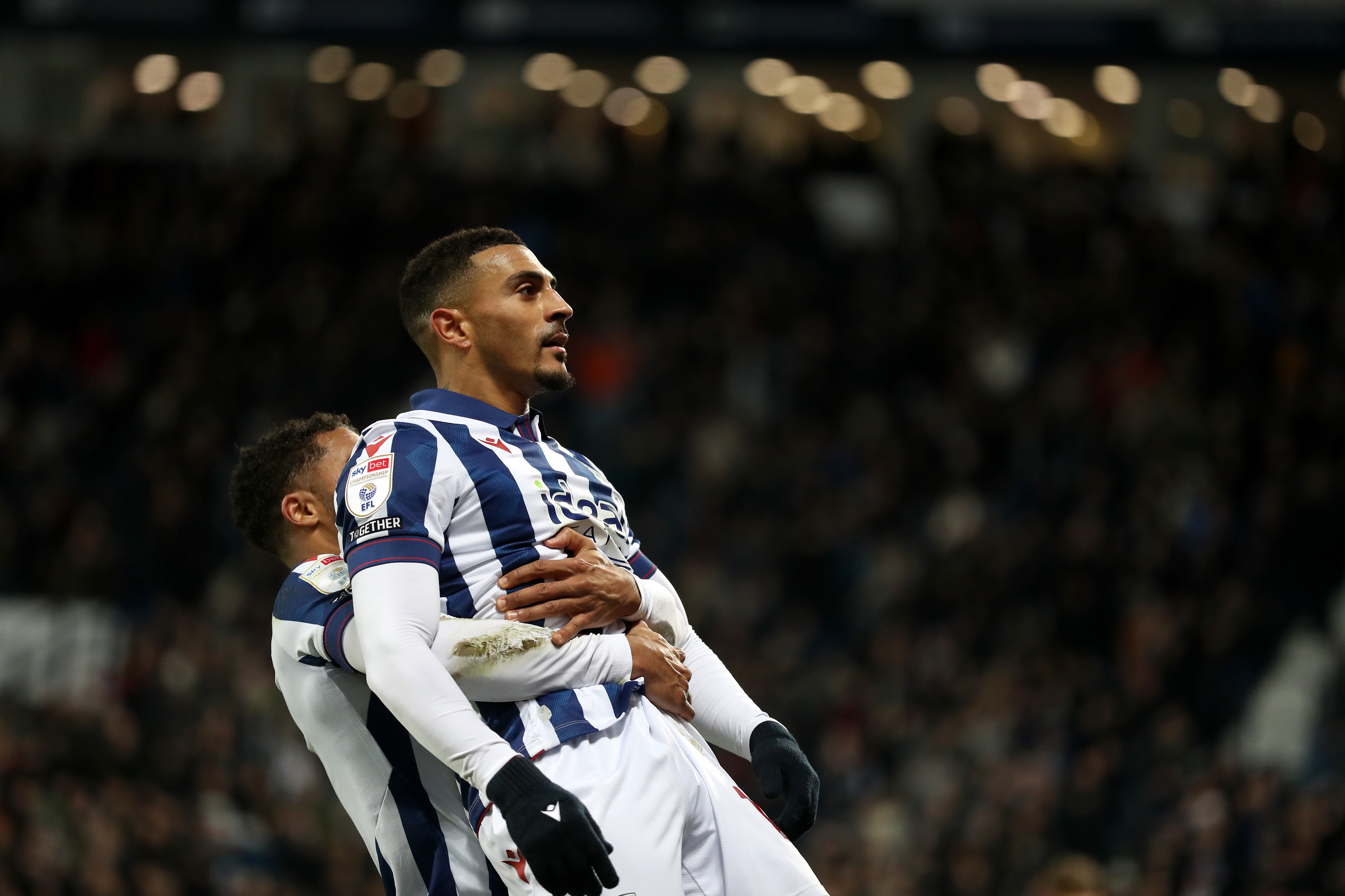 Karlan Grant celebrates scoring against Coventry City with team-mates