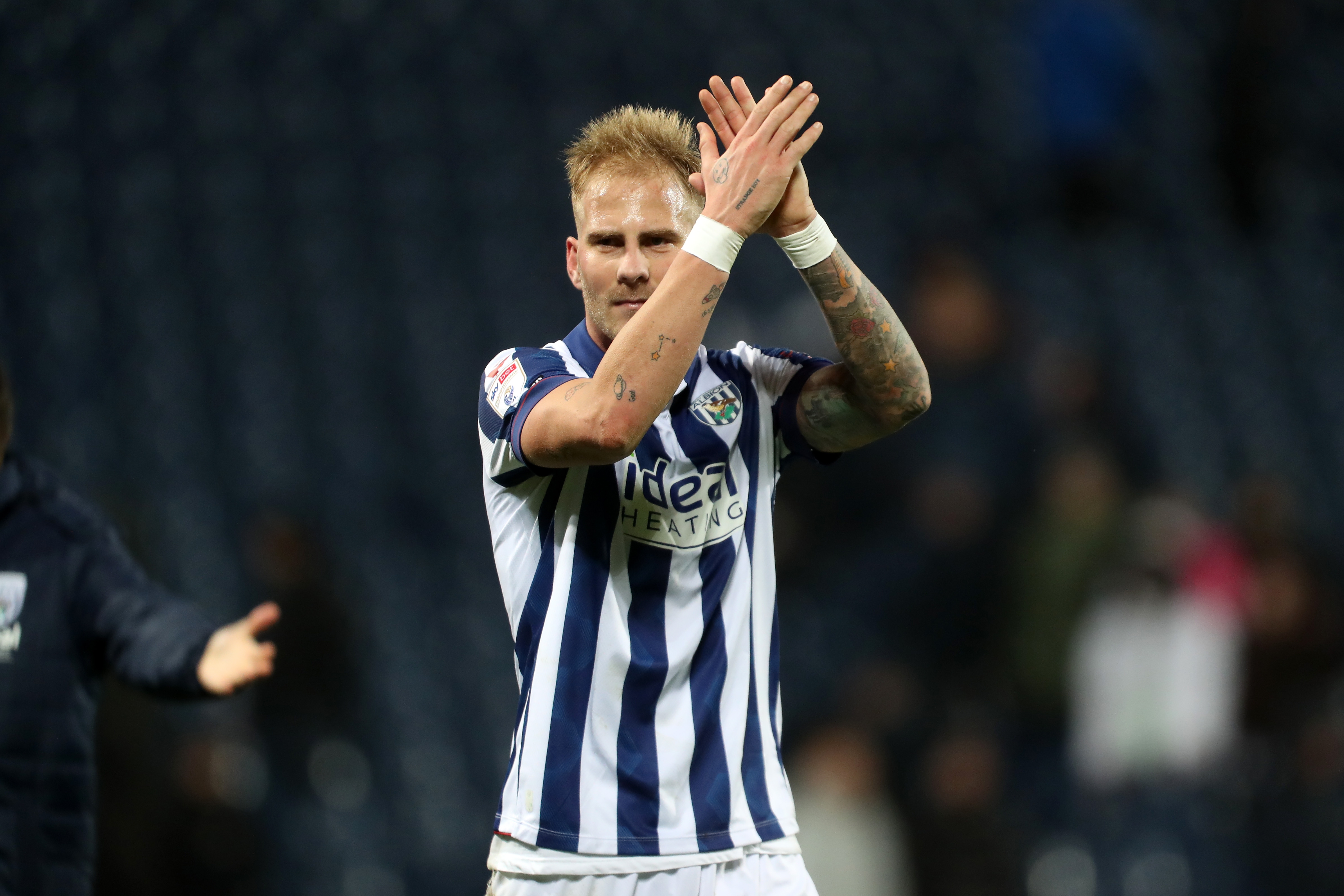 Uroš Račić applauds Albion fans following the win over Bristol City