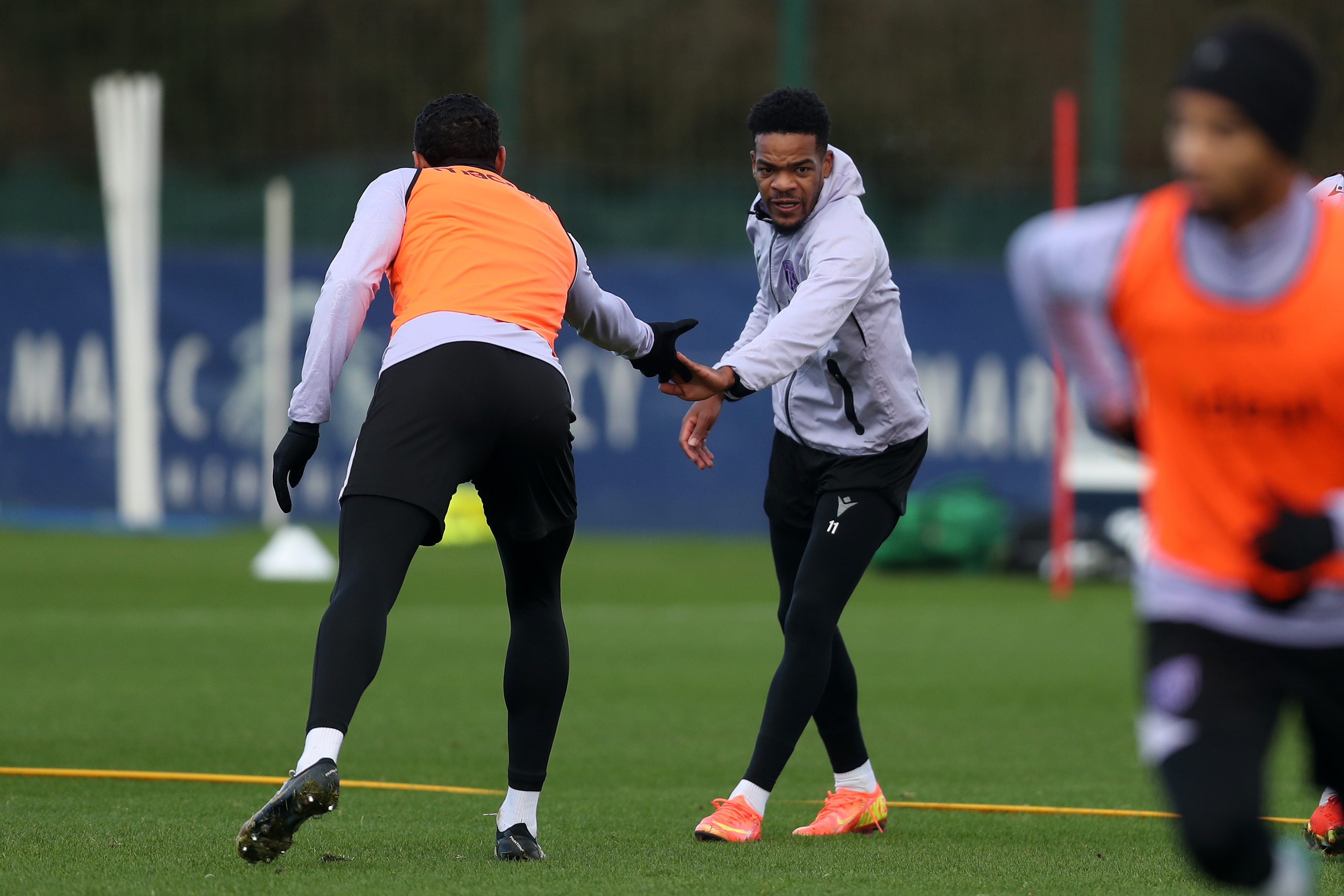 Grady Diangana and Kyle Bartley shake hands during training 